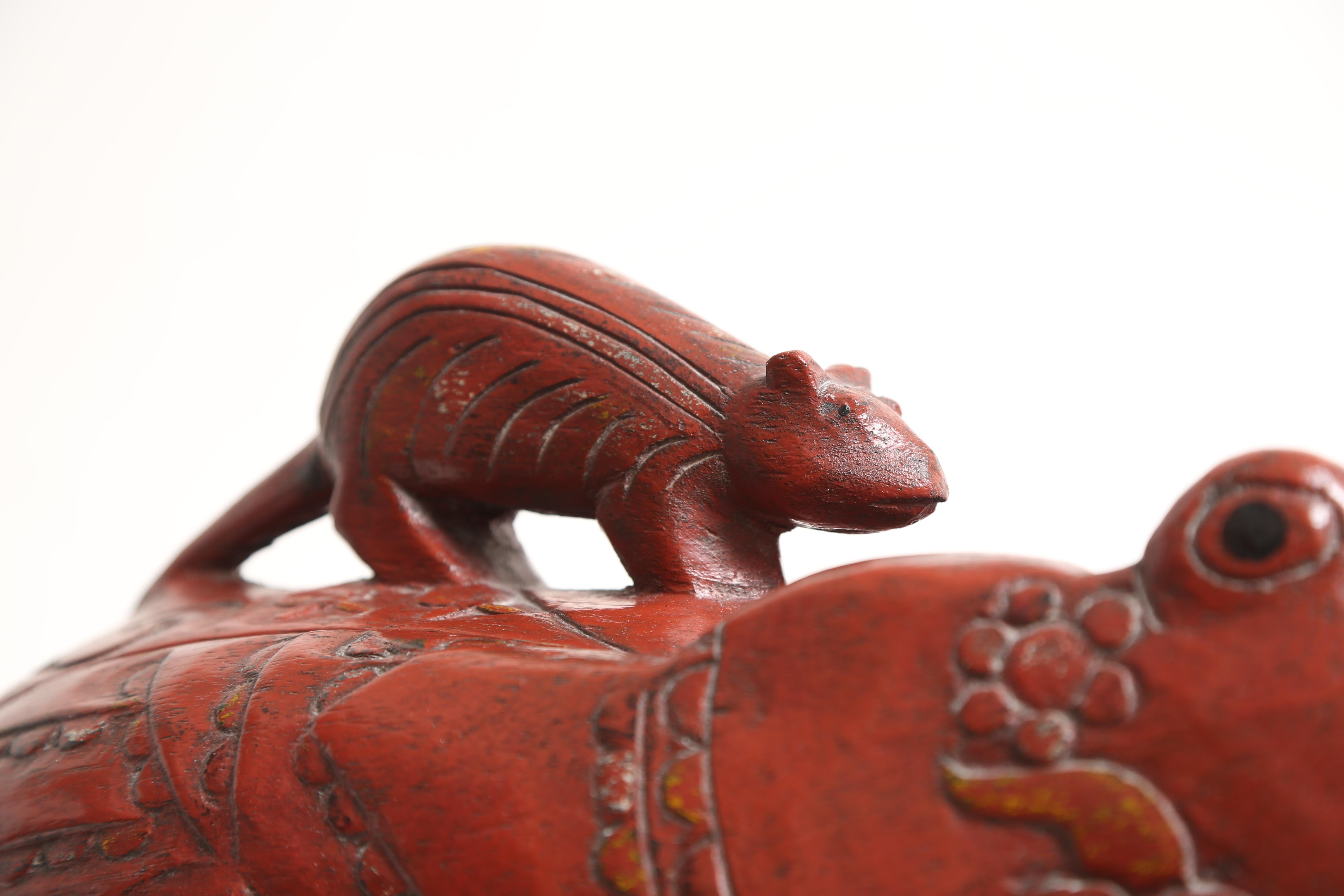 A great table-top object.
This example exhibits a lovely patinated finish.
Mouse riding on a frog's back.