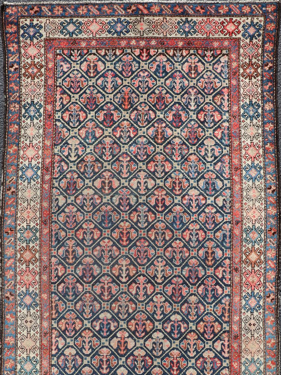 Tribal antique Persian Hamedan rug in midnight blue, red, cream in repeat Geometric Design. rug R20-0838, country of origin / type: Iran / Hamedan, circa 1910

This Persian Hamedan features a unique blend of colors and an intricately beautiful