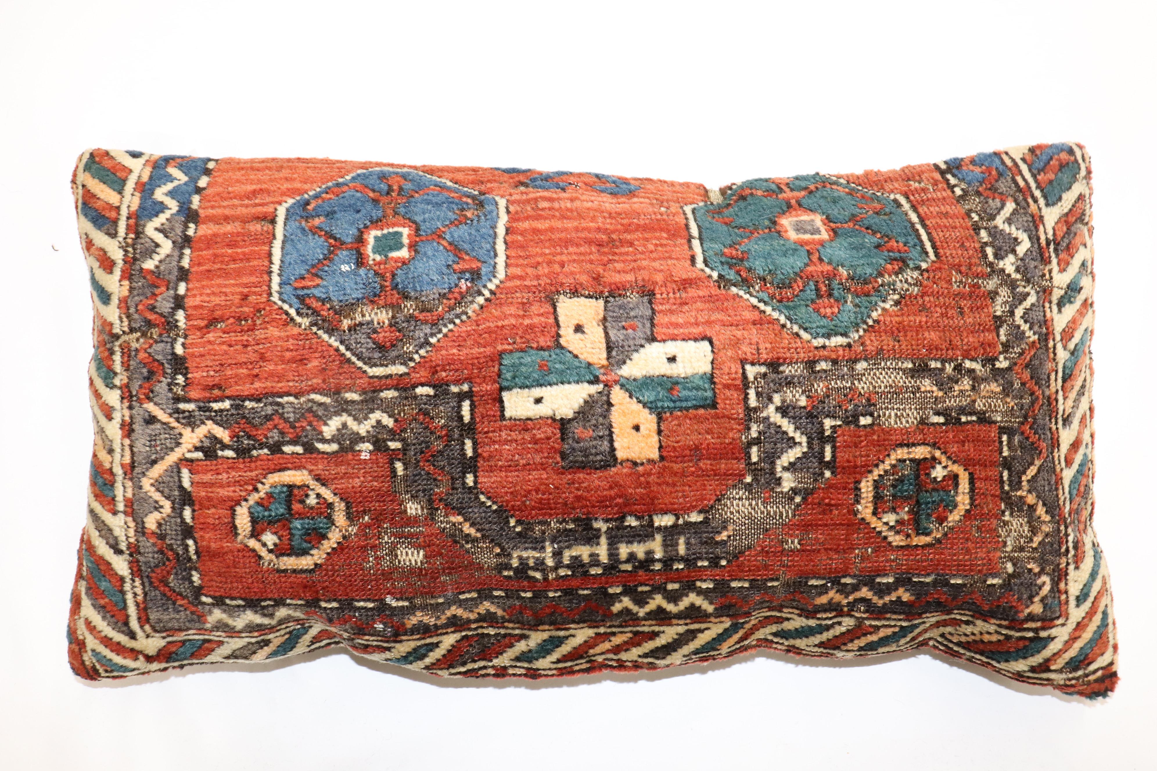 Largepillow made from an early 20th century Antique Persian Kurd Rug rug. Zipper closure and poly-fill provided.

Measures: 16'' x 30''.