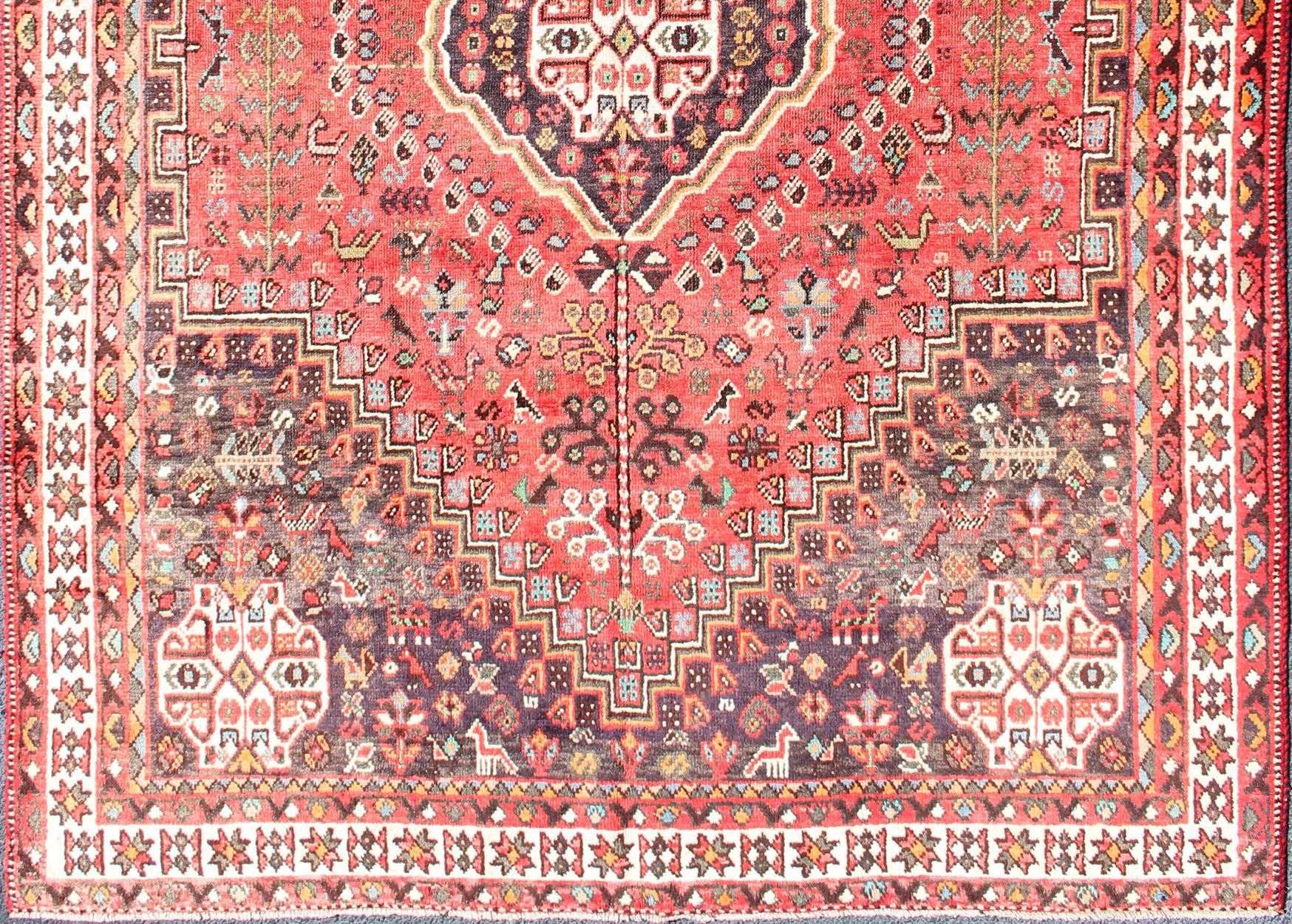 Persian Shiraz antique rug in brown and blue with Medallion geometric design, H20-0903 country of origin / type: Iran / Shiraz, circa 1950.

This vintage Persian Shiraz rug (circa mid-20th century) features a unique blend of colors and an