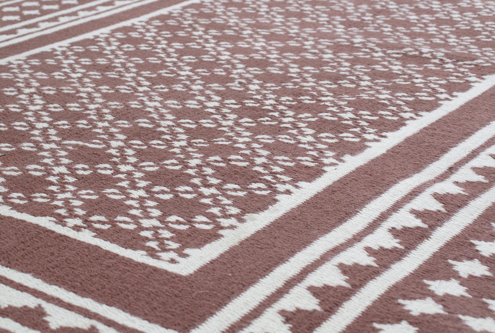 This tribal style flat-weave rug is made with 100% handspun cotton and natural dyes. It is inspired by the antique Zeillu kilims that are native to the Yazd region in Iran. Nasiri continues their rich tradition of rug making by applying the same