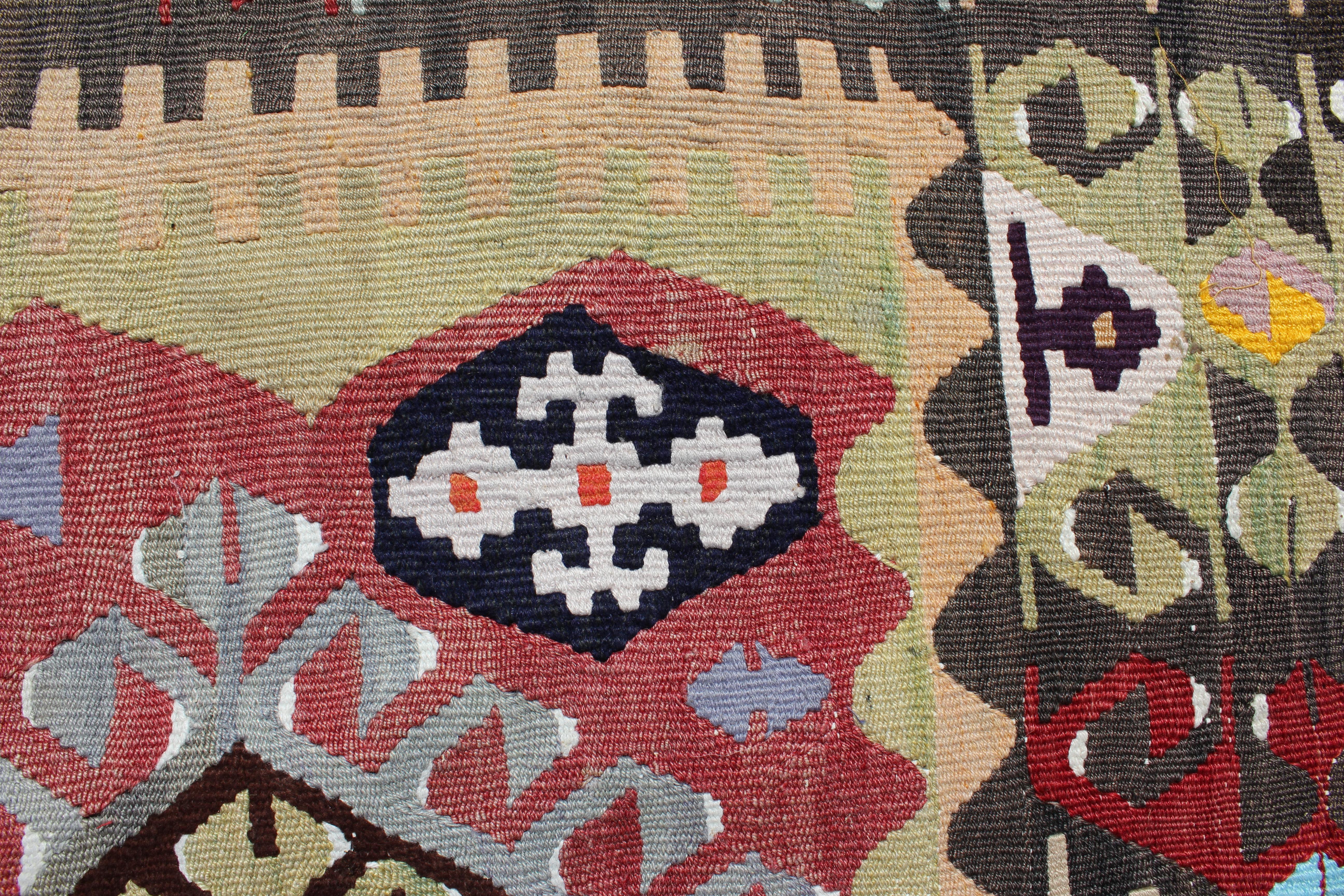 Late 20th Century Tribal Print Wool Turkish Kilim with Red, Brown, and Blue Tones