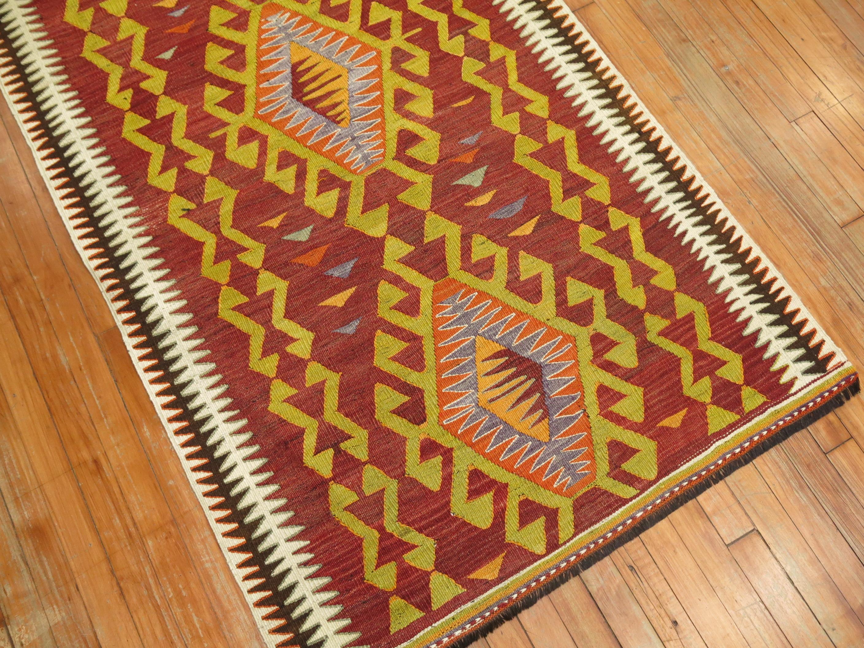 20th century geometric Turkish runner in casual tones red, green and orange tones. The border is ivory and brown.

Measures: 3'6