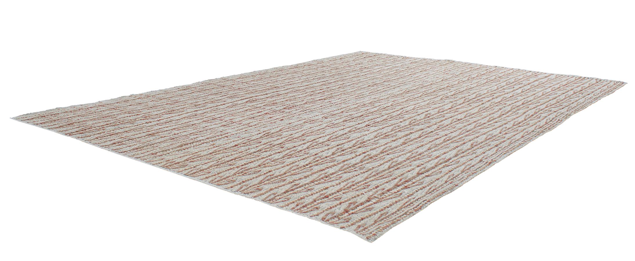 This Ricci flat-weave rug is made with handspun wool and cotton, and natural dyes. It is inspired by the antique kilims that are native to the Kurdish region in Iran. NASIRI continues their rich tradition of rug making by applying the same