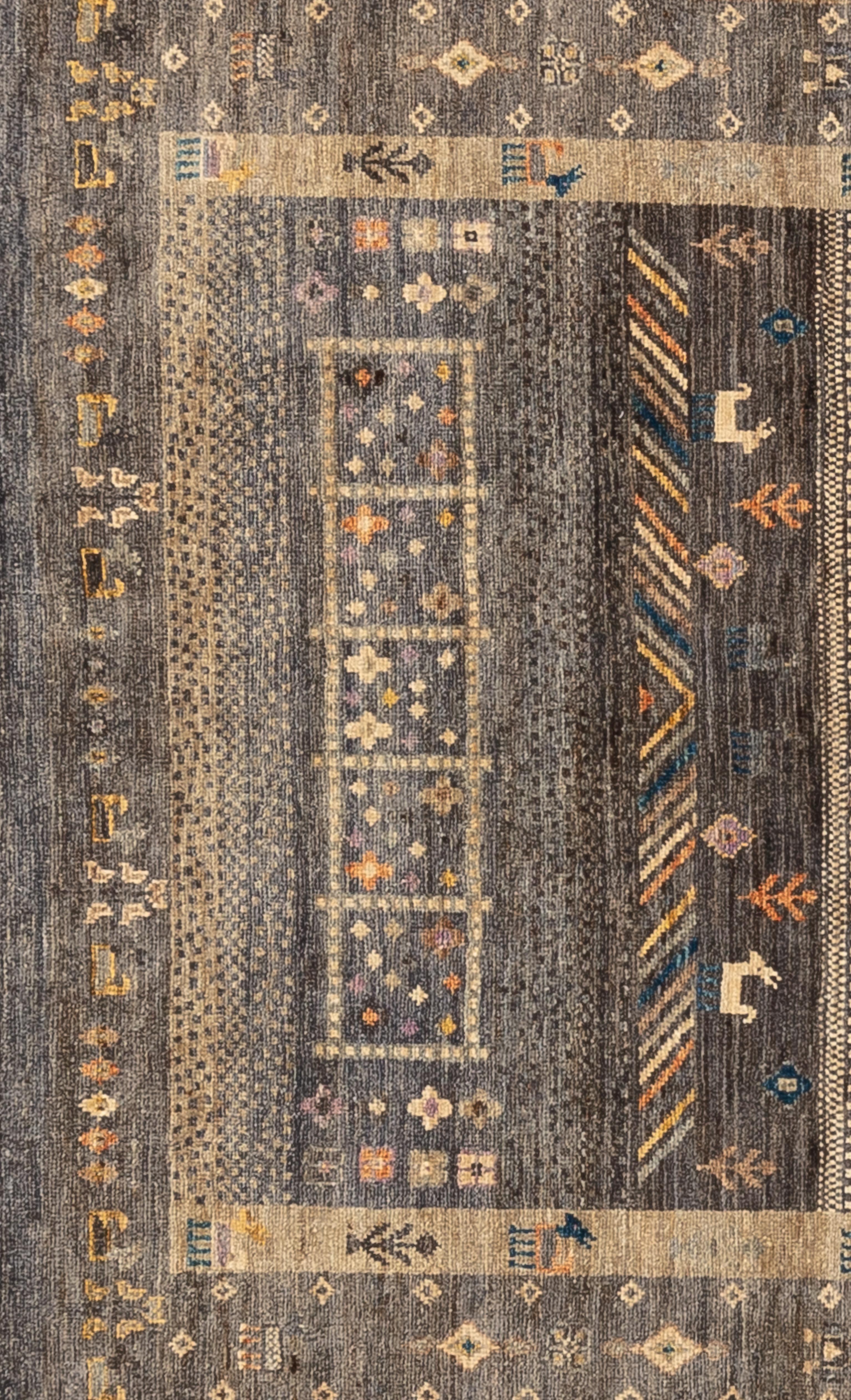 This unique, earth-toned tribal is inspired by a gabbeh rug. Certain symbols evolved to impart love, prosperity, and good fortune to their families. Handwoven with 100% handspun wool, in the subtropical woodlands of Pakistan. 

Size - 4'4