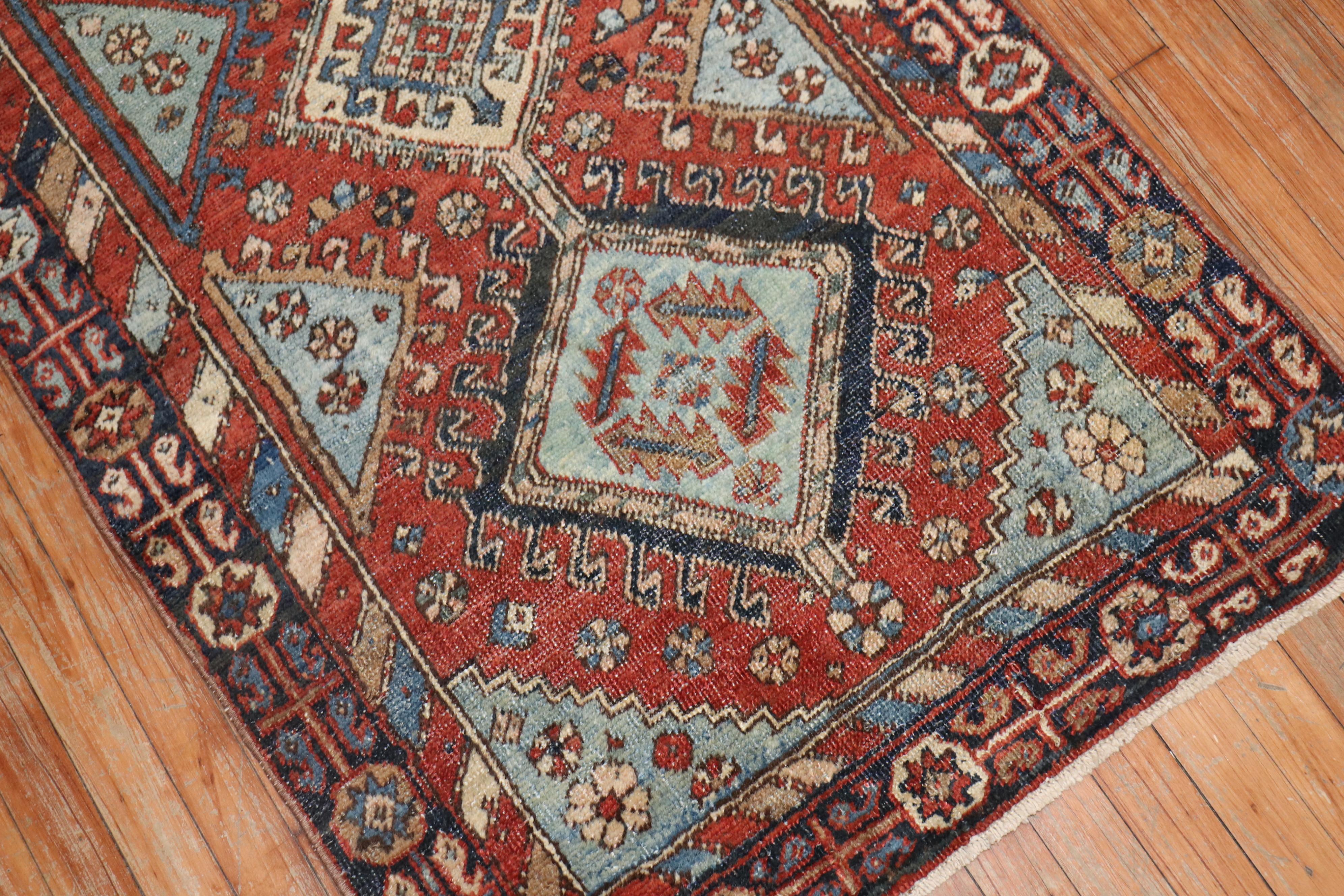 Persian Heriz Tribal scatter rug in rustic tones.

Measures: 2'10” x 5'5”.
