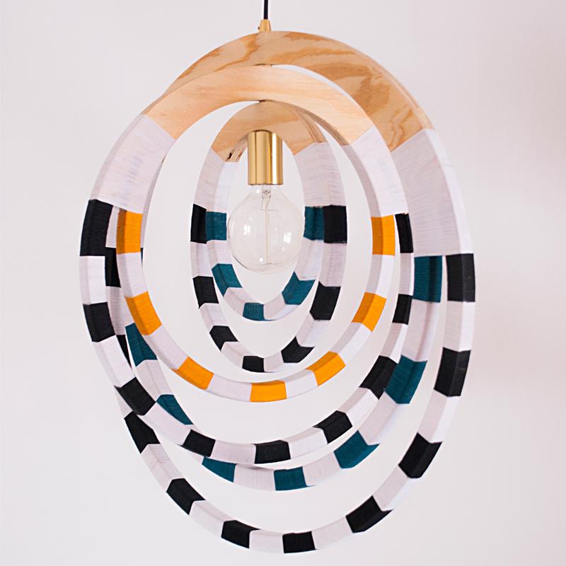 This signature designer pendant embodies the shape of the memorable, and traditional South African Ndebele necklaces.

The spatial design and its sleek aesthetic bring an individual look and add depth to your living room décor. 

The Signature