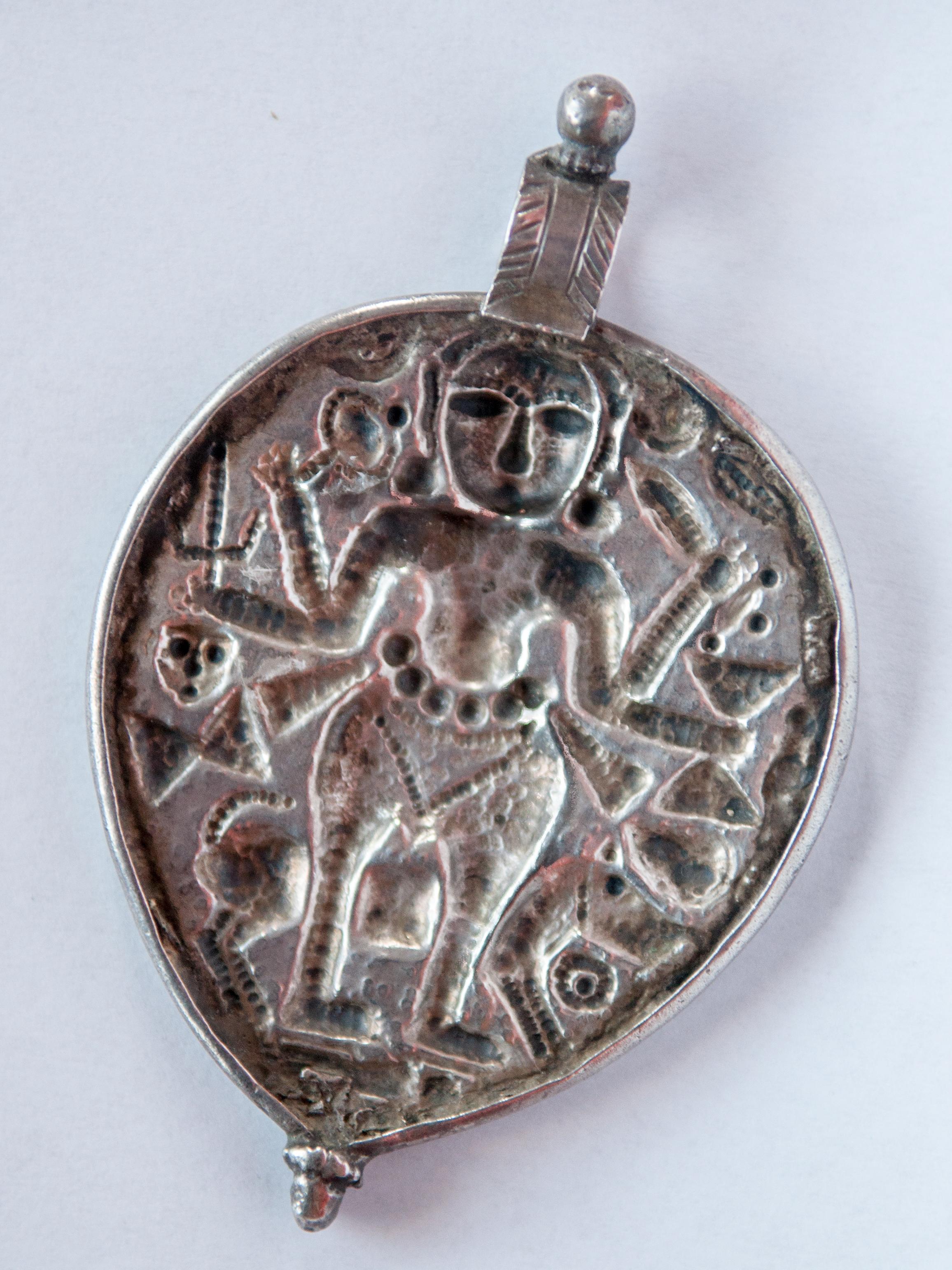Indian Tribal Silver Pendant from India Depicting Kali, Repousse Work, Mid-20th Century