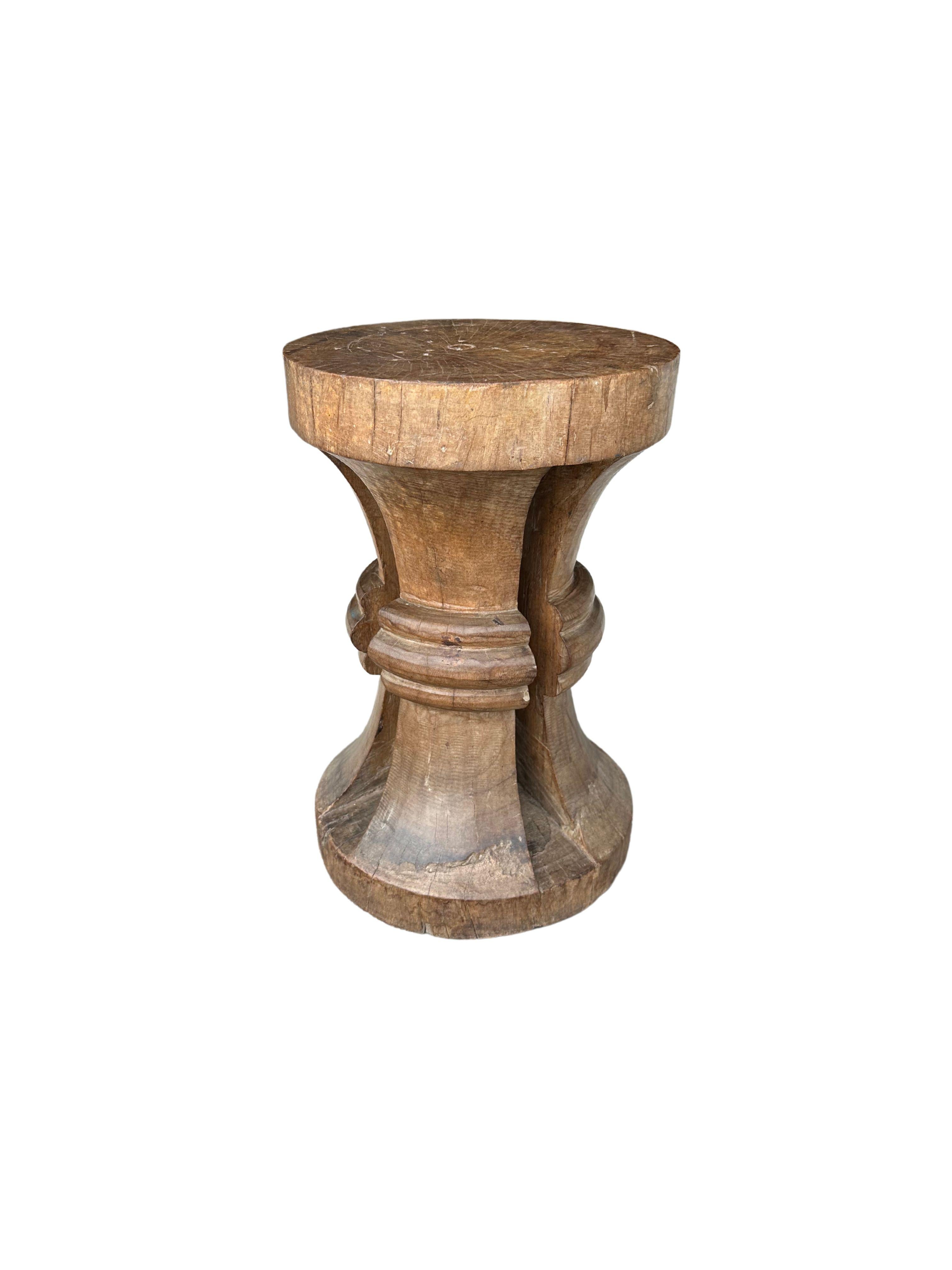 A tribal stool hand-carved by the tribes people of Nias Island, Indonesia. Nias is the largest island amidst the Mentawai Archipelago, located off the North-western coast of Sumatra, Indonesia. A wonderful sculptural object that features an