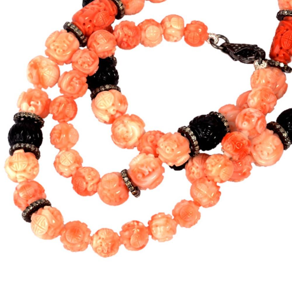 Gorgeous hand-carved onyx & coral beaded necklace accented with sparkling diamonds made in Silver. A unique and stunning jewelry piece for any occasion

Diamond:4.96ct,
Silver:11.52gm,
Coral:308.60,
Onyx:69.45
Size: 702mm