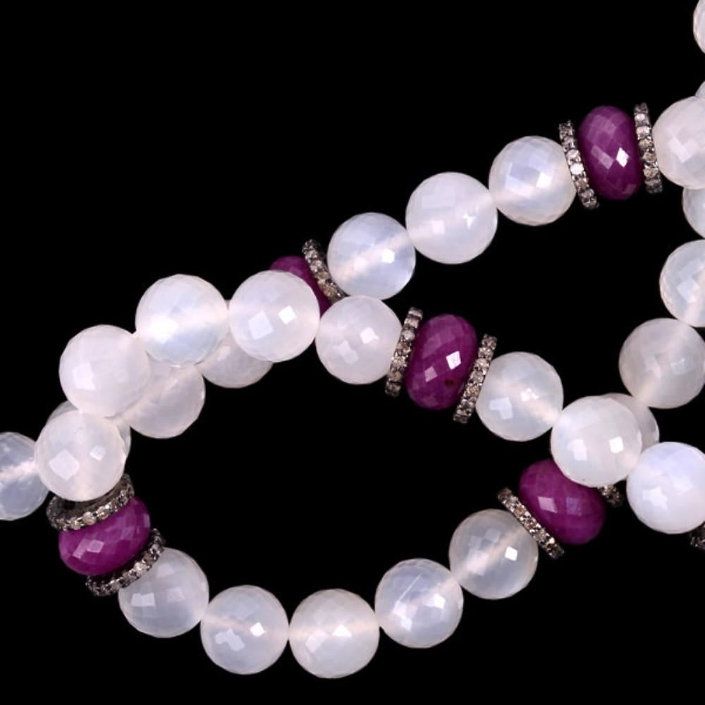 Tribal Style Moonstone & Ruby Beaded Necklace with Diamond Accents, Handmade in Sterling Silver. Make a bold statement with this unique necklace featuring mesmerizing moonstone & ruby beads, glistening diamond accents, and a tribal-inspired silver