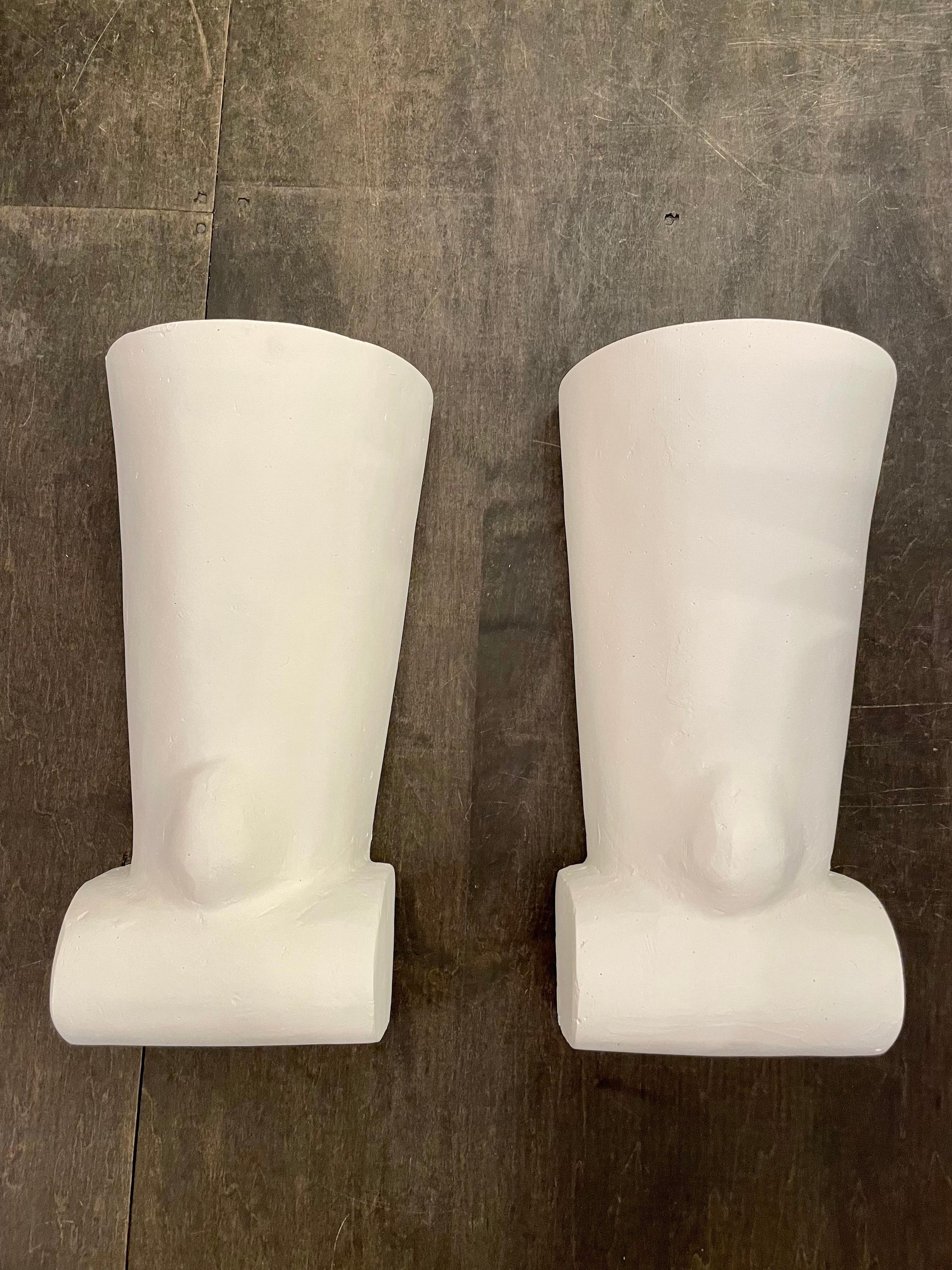 This lovely pair of custom designed wall lights in painted plaster with an up light (single Edison socket).  Slight variations in finish and texture. Exceptionally crafted, molded and finished by hand studio pieces. All new electrical, new wiring. 