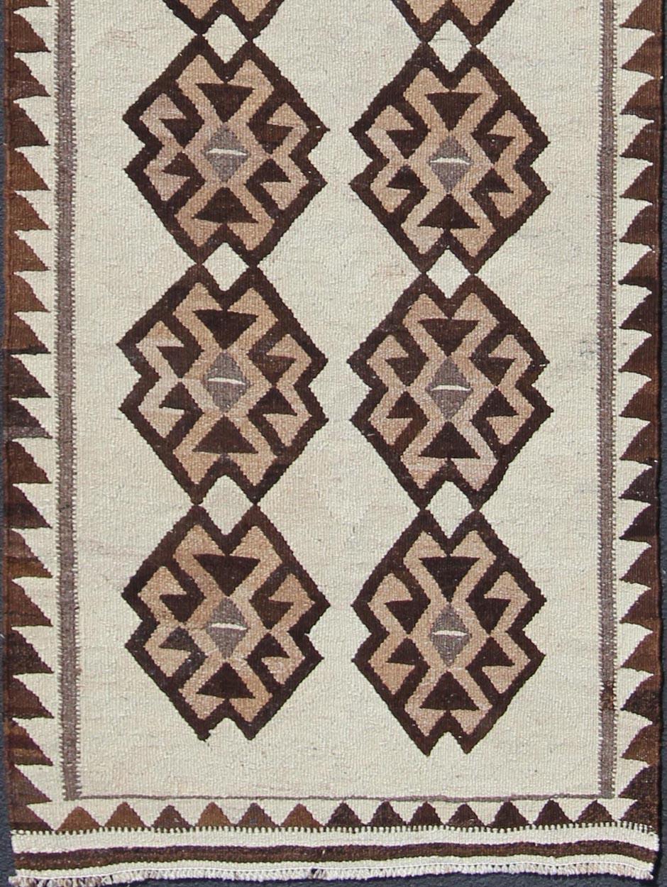 Hand-Woven Tribal Vintage Turkish Kilim in Creams, Black, and Browns For Sale