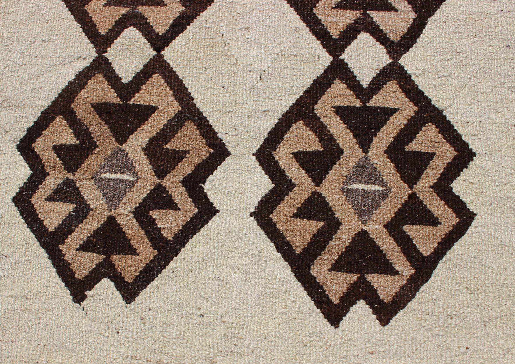 Wool Tribal Vintage Turkish Kilim in Creams, Black, and Browns For Sale