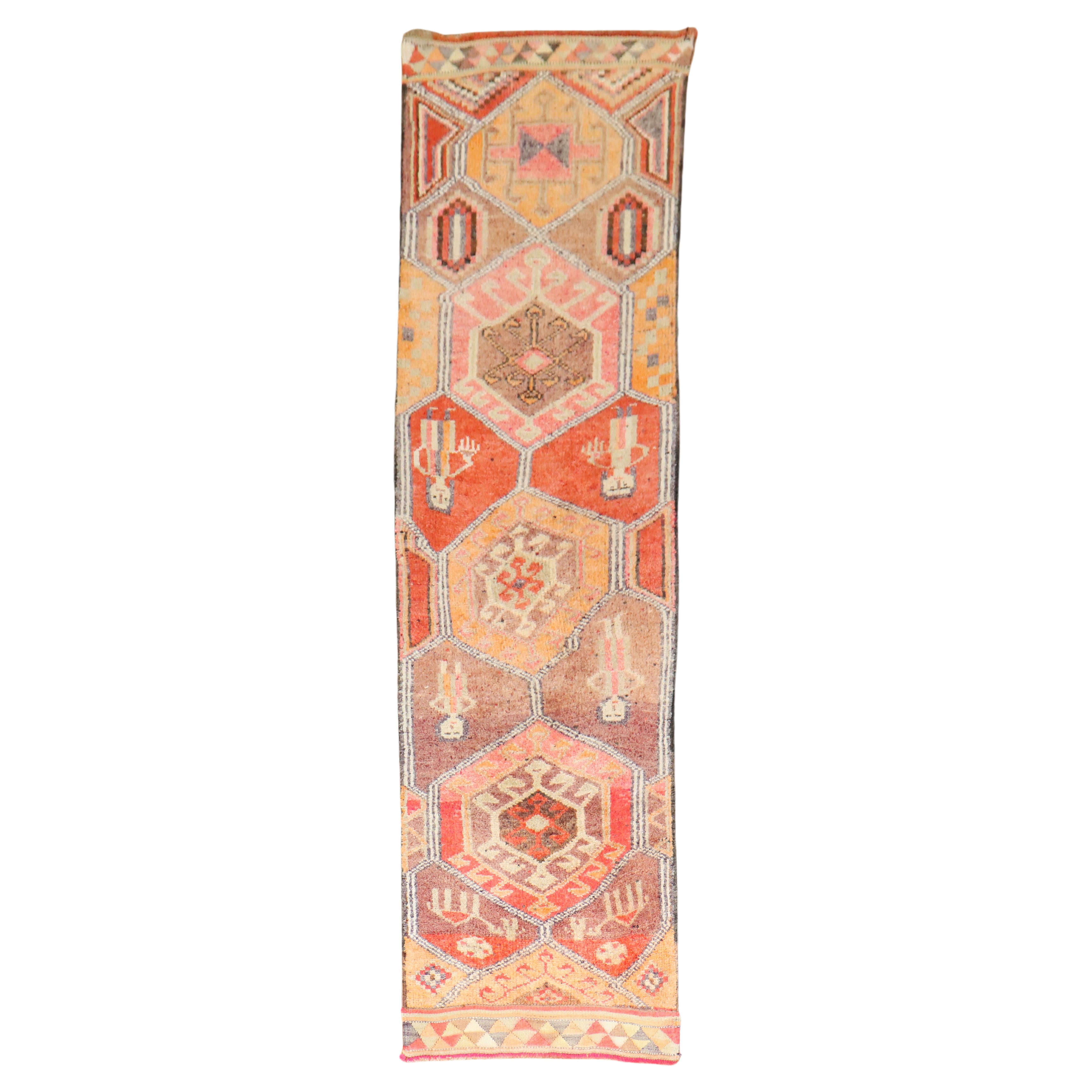 Mid 20th century Tribal Turkish Geometric runner featuring 2 men and 2 women on a geometric colorful motif

Measures: 2'10'' x 10'3''.