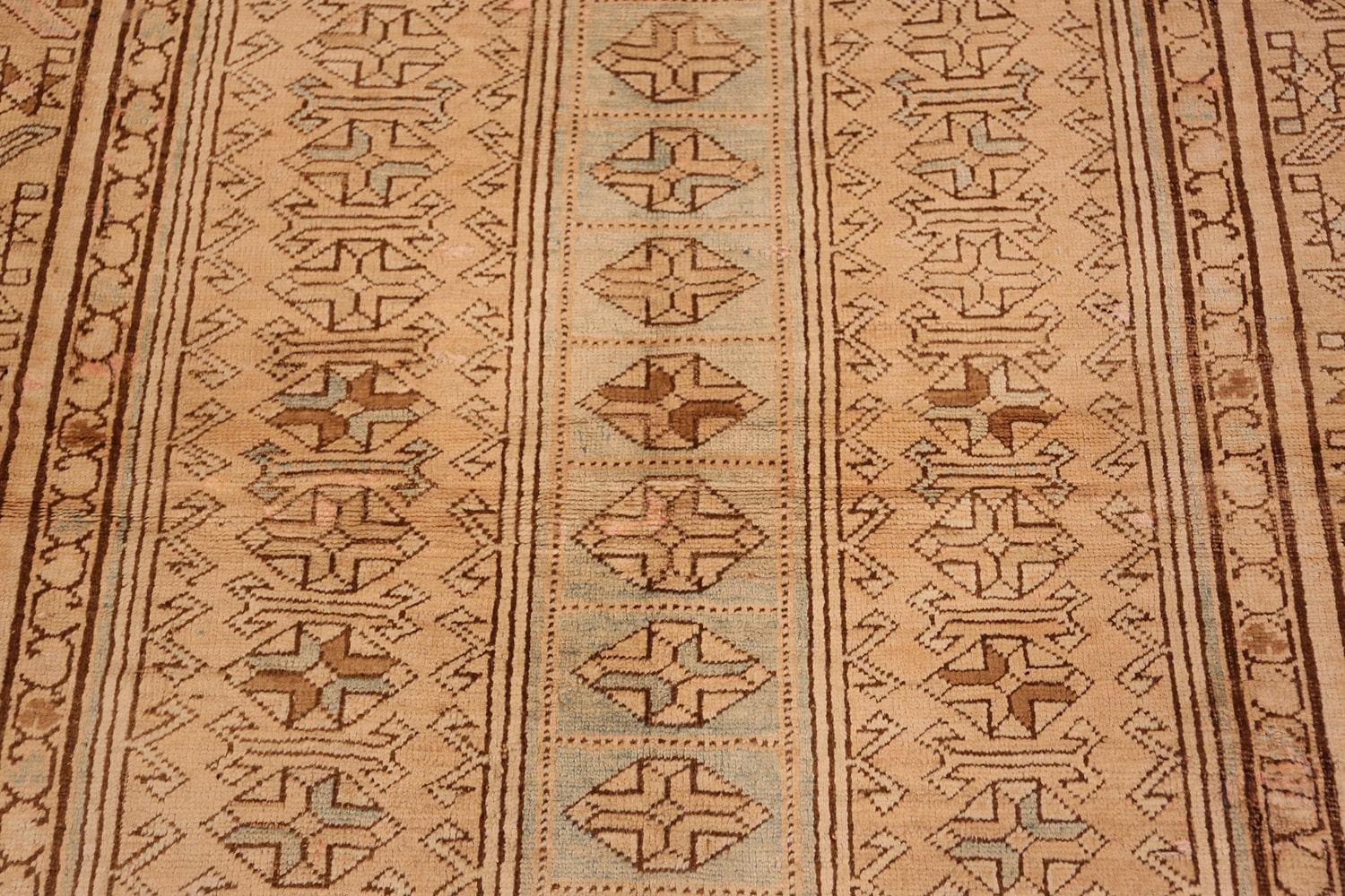 Vintage Caucasian Kazak rug, country of origin: Caucasus, date: circa 20th century - Size: 4 ft 3 in x 9 ft (1.3 m x 2.74 m). The creamy body of this vintage Caucasian rug is decorated with three banners aligning along the vertical, the outer two
