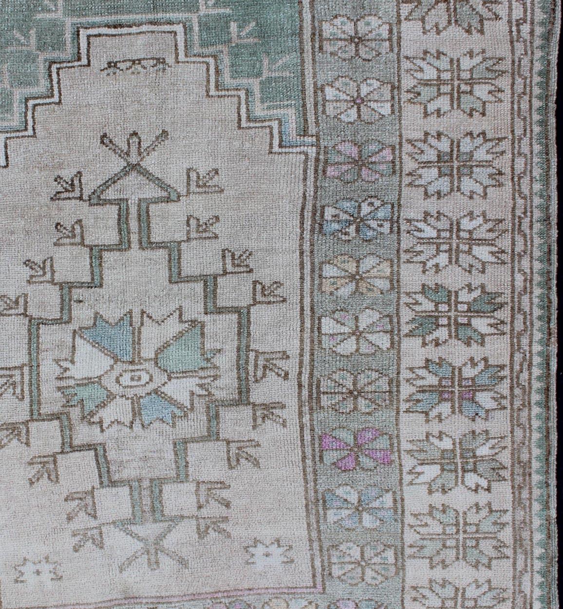 Tribal Vintage Turkish Oushak Square Rug With Medallion in Soft Green and Creams

Vintage tribal Turkish Oushak square size rug with medallion in tan, cream and light green, Keivan Woven Arts/ rug EN-176994, country of origin / type: Turkey /