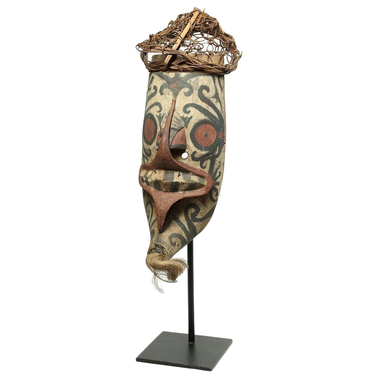 Tribal Wood and Pigment Dayak Hudoq Mask on Stand, Early 20th Century Borneo