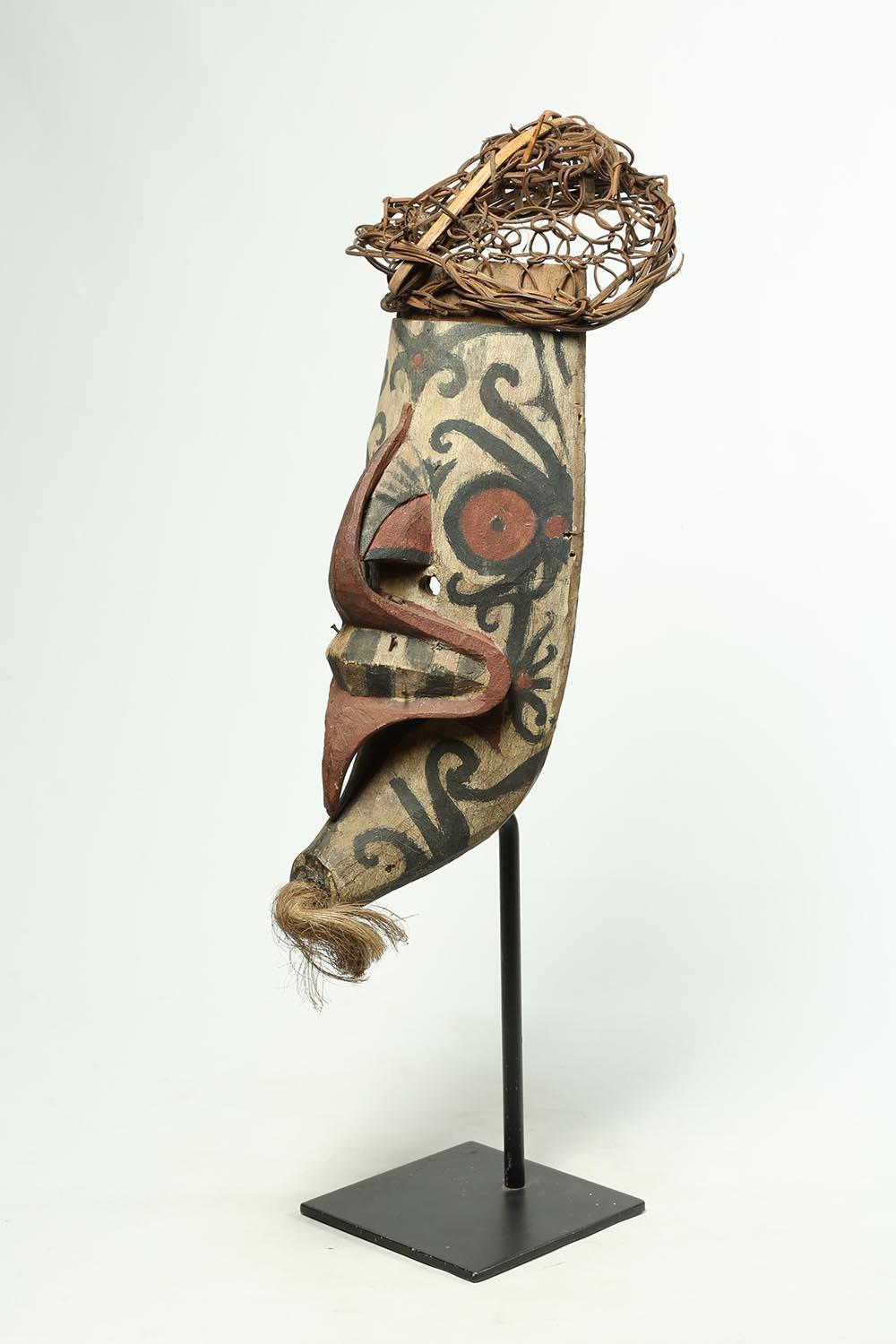 Hand-Carved Tribal Wood and Pigment Dayak Hudoq Mask on Stand, Early 20th Century Borneo