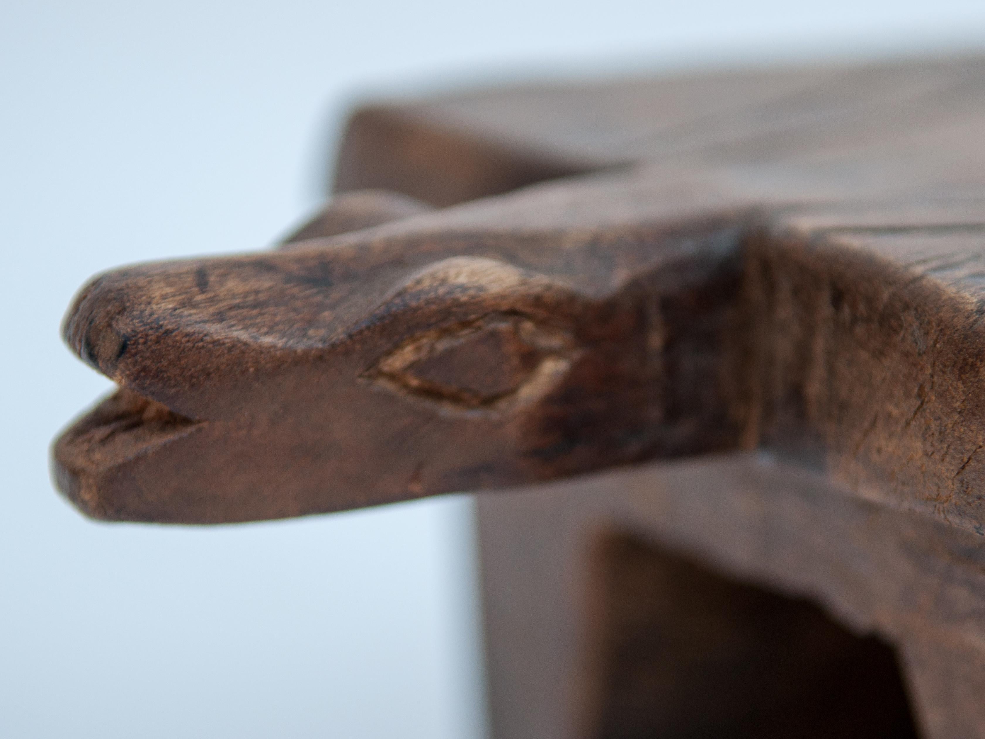 Small tribal wooden stool with lizard motif. 15