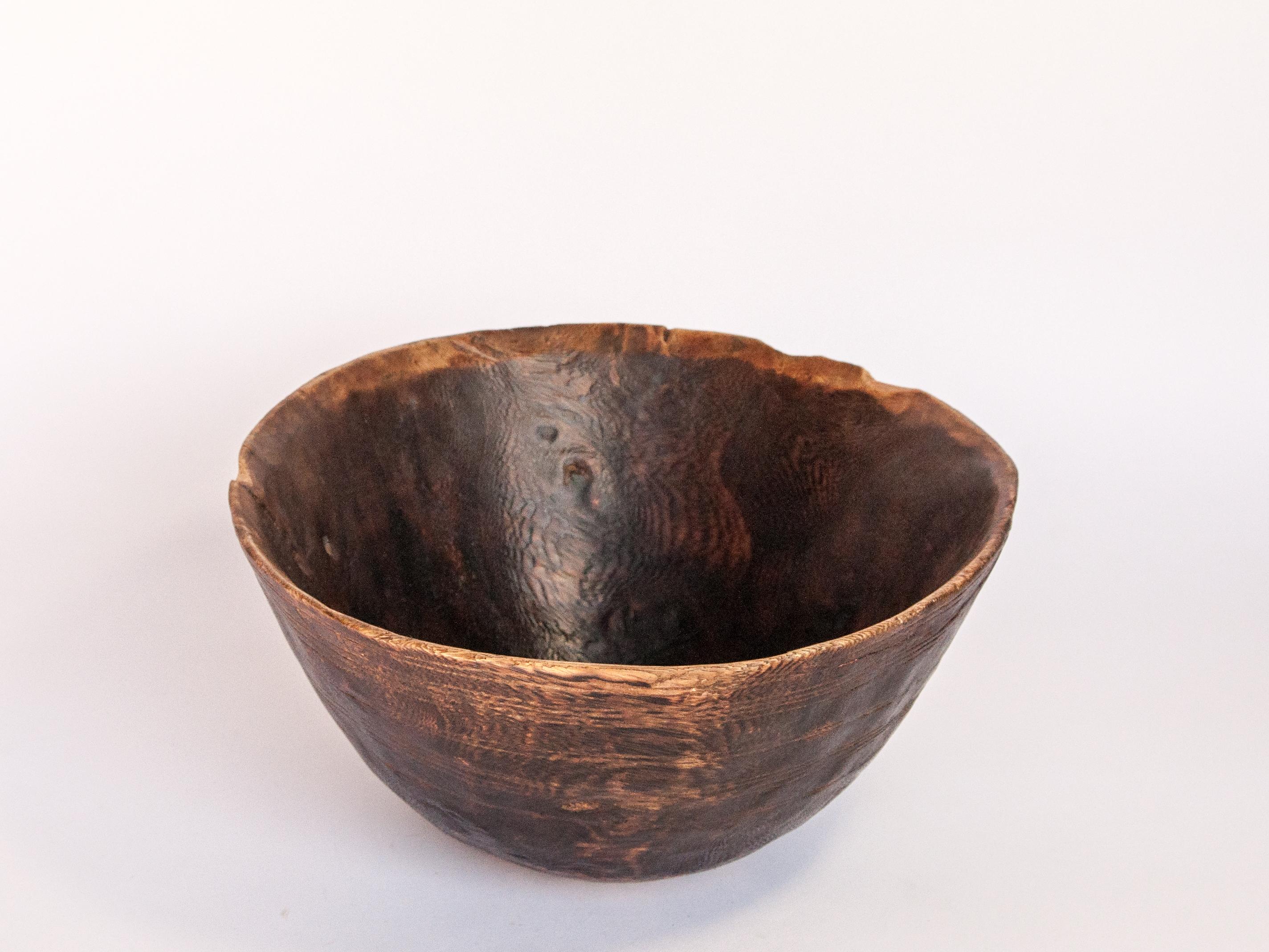 Tribal wooden bowl. Strongly figured wood. Tuareg. West Africa, mid-20th century
This striking wooden food or grain bowl comes from the Tuareg, a nomadic people of the West African Sahel. It was fashioned by hand using very basic tools and