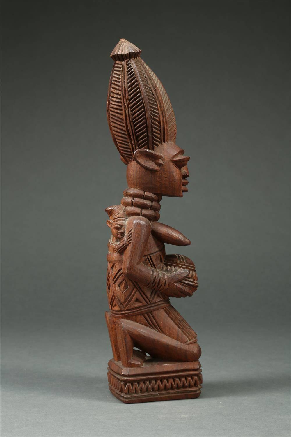 Hand-Carved Tribal Yoruba Maternity Figure holding a Bowl, Signed J.A. Fakeye, Nigeria