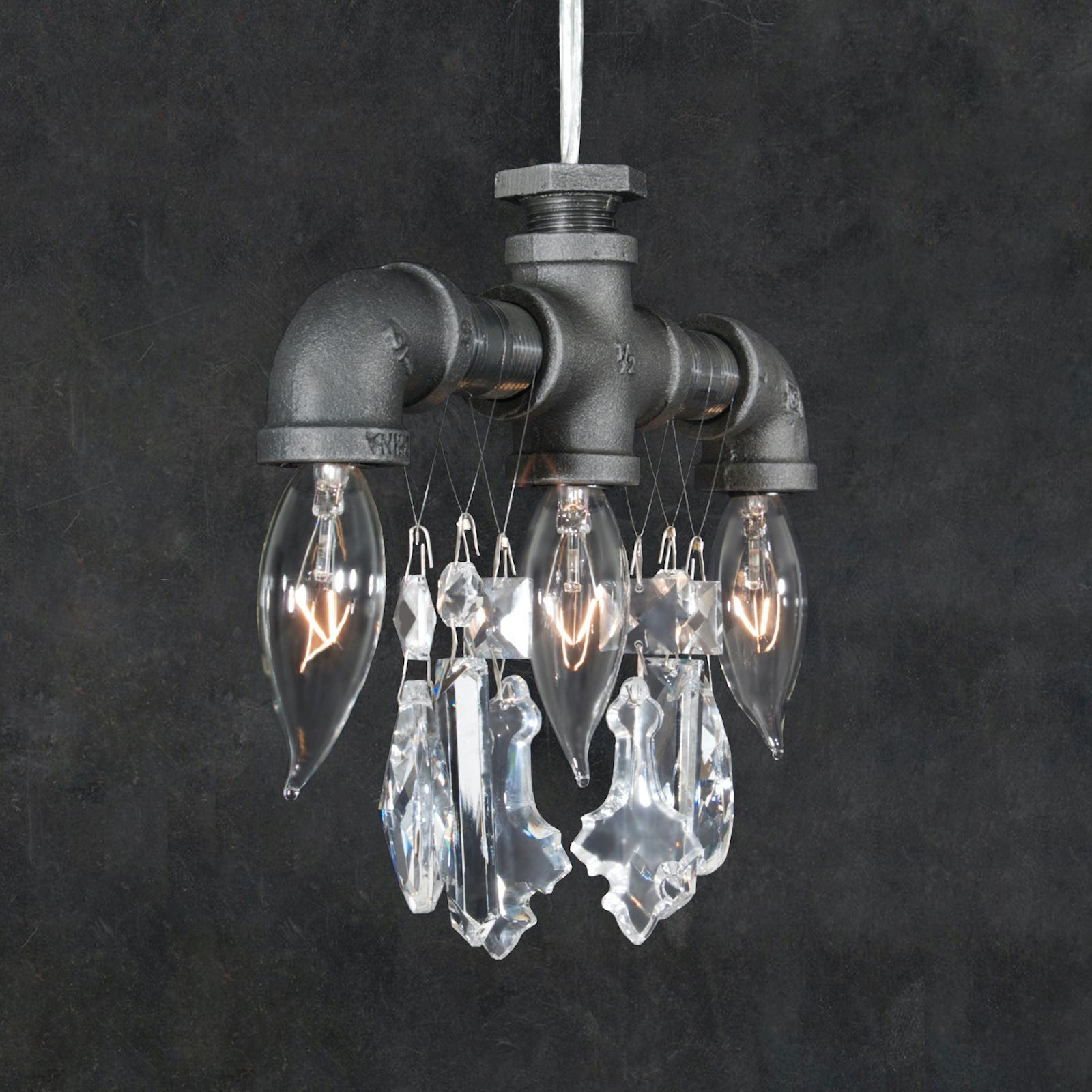 This three-bulb Tribeca chandelier pendant is an Industrial-chic light comprised of rough black steel pipes and fittings, contrasted with high-quality gem-cut crystal. Often used to light up areas where a single source of light just won't do. This