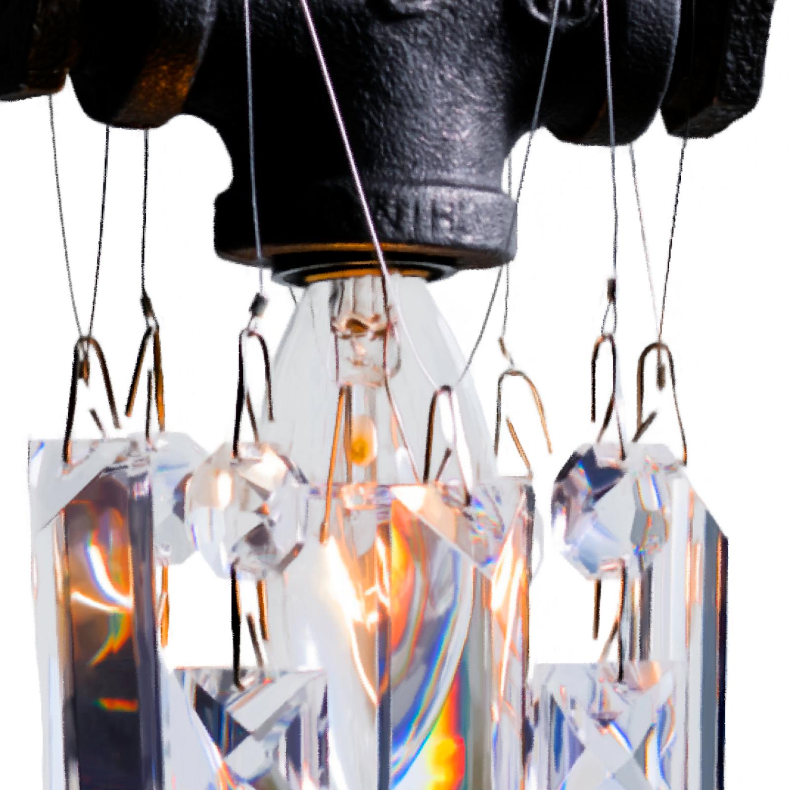 This single-bulb Tribeca chandelier pendant is a small jewel of an industrial-chic crystal pendant. Made from rough, masculine black steel gas fittings and high-quality gem-cut crystal, this little sparkler exudes urban sophistication and contrast.