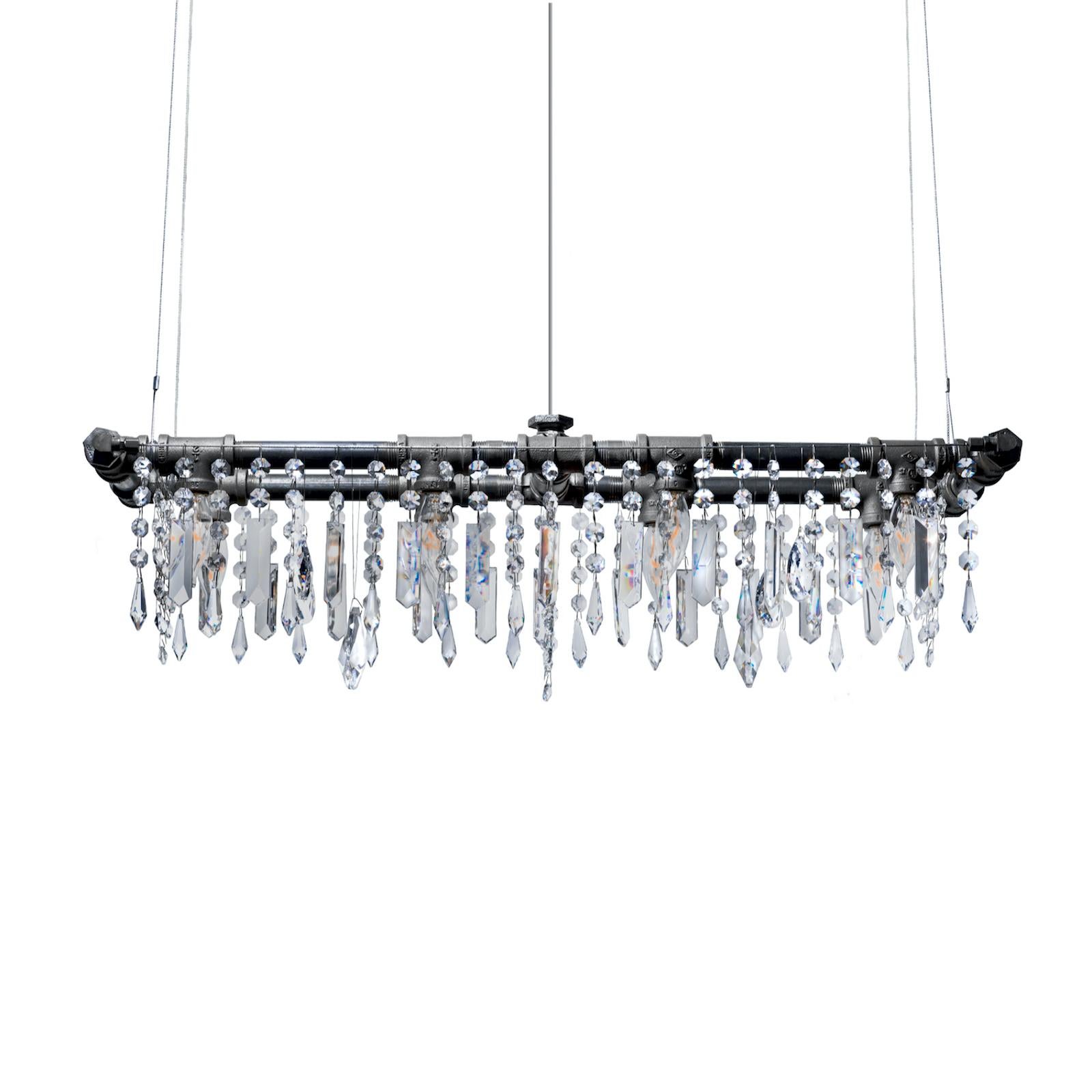 Tribeca Mini-Banqueting Chandelier, 8 Bulb, by Michael McHale
Dimensions: D 23 x W 70 x H 23 cm.
Materials: steel, optically-pure gem-cut crystal.

8 x candelabra base CA7 bulb, either incandescent or LED

All our lamps can be wired according