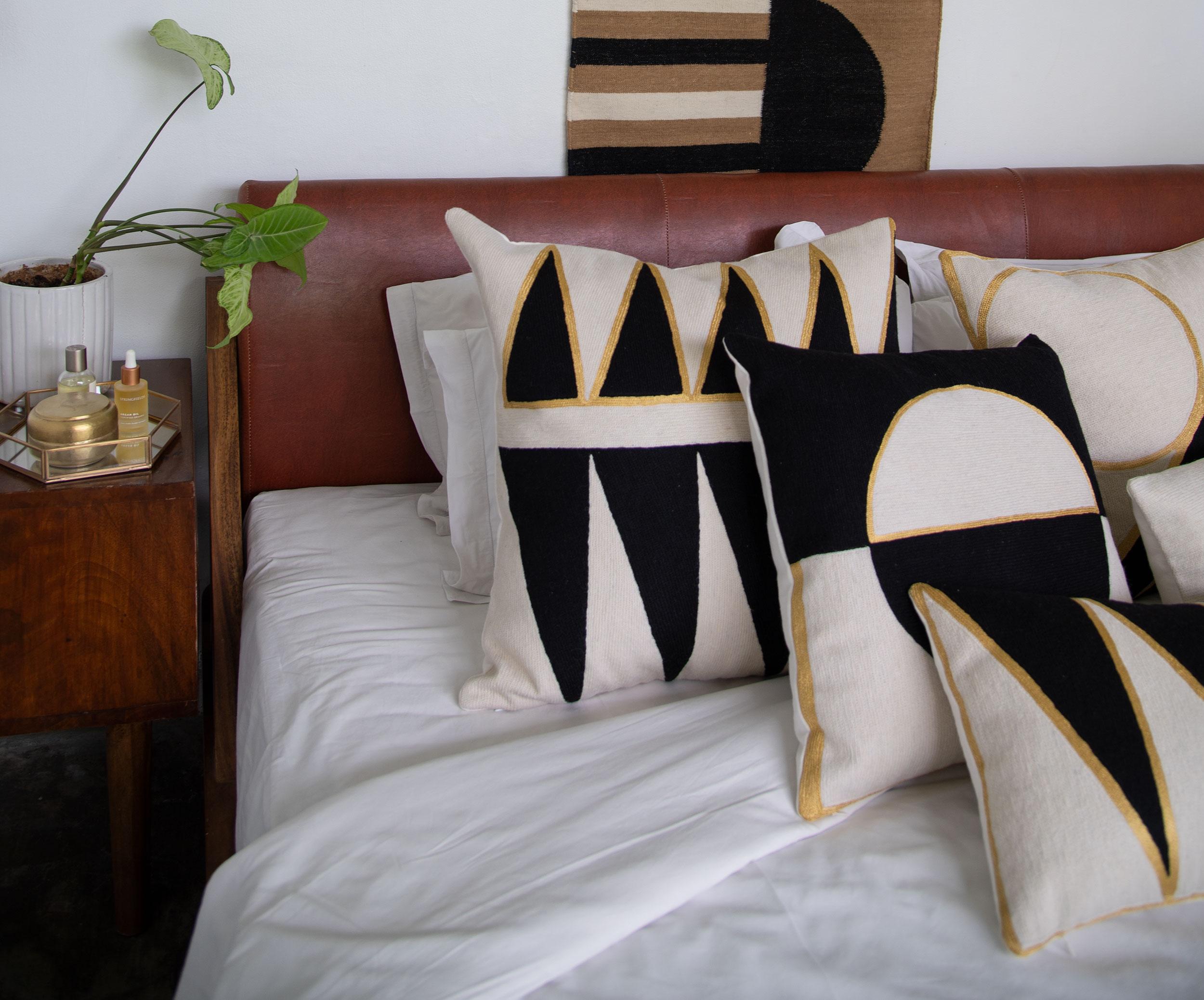 These geometric throw pillows have been ethically hand embroidered by artisans in Kashmir, India, using a traditional embroidery technique which is native to this region.

The purchase of this handcrafted pillow helps to support the artisans and
