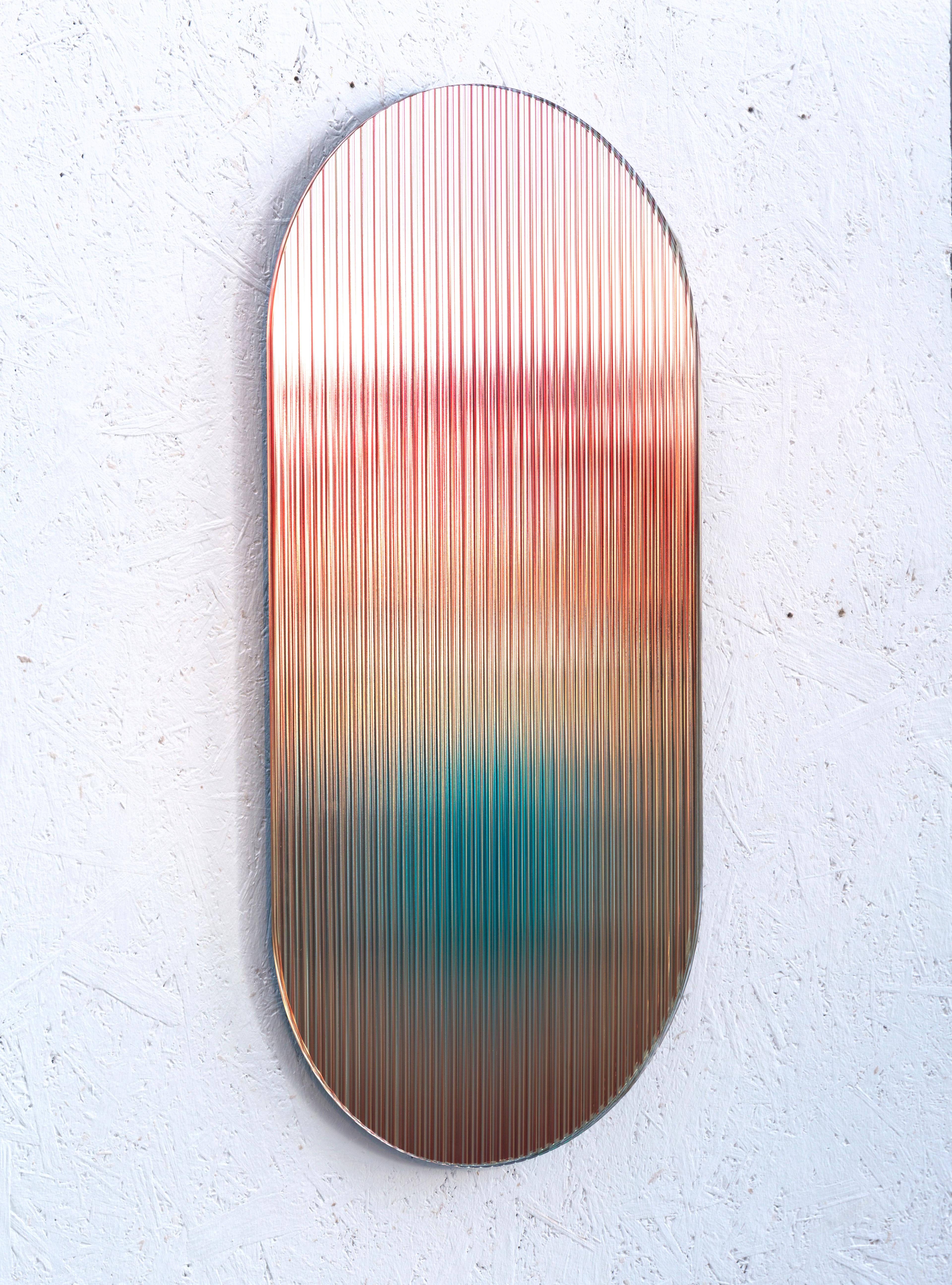 A reflective, coloured patterned glass panel designed to add a palette of colour to spaces. The piece disperses light through it’s rippled reflective surface creating a blended dimensional palette of colour. The piece visually shifts creating