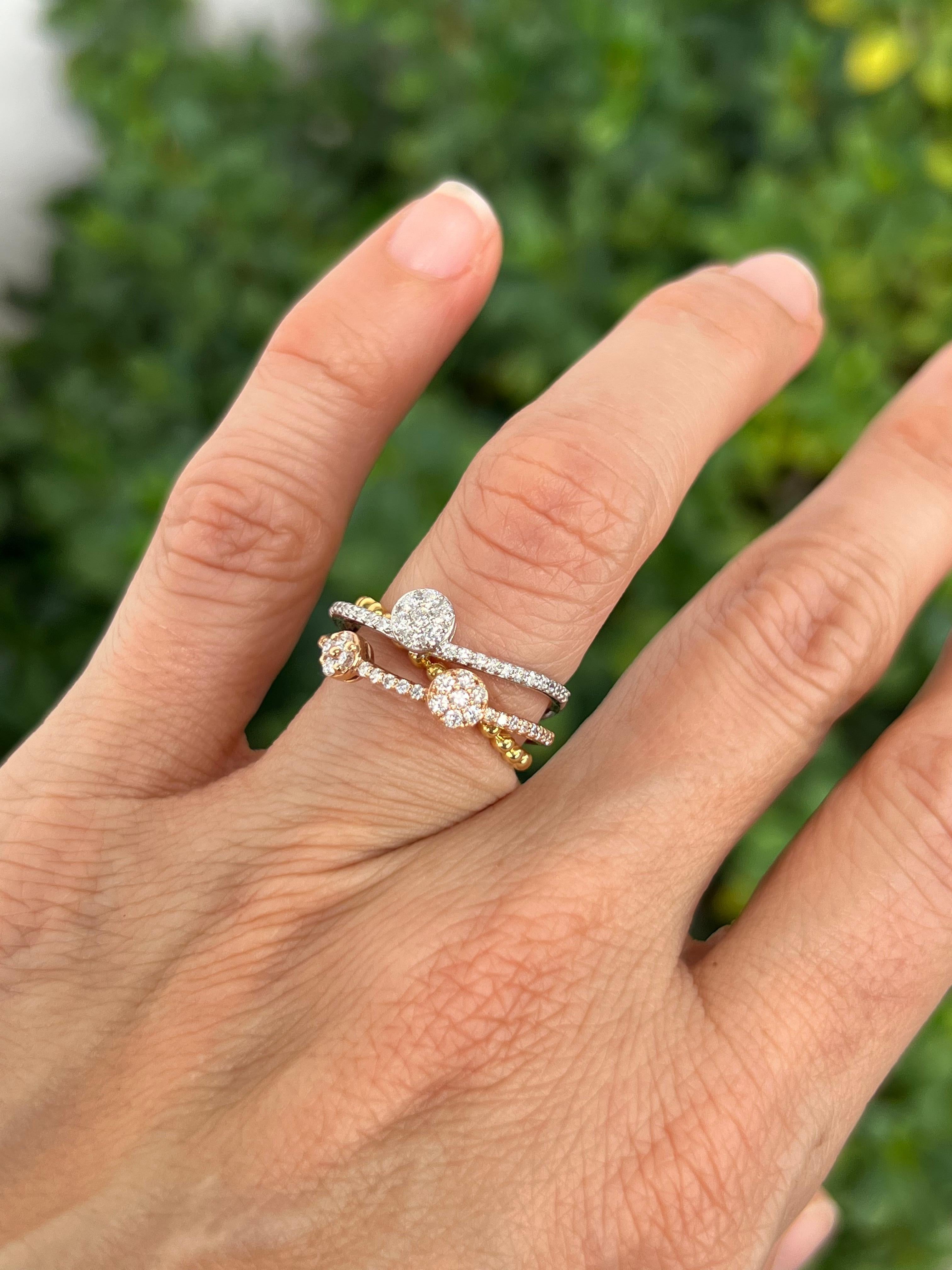Movement and texture add interest to this tricolor ring. 

Features
18K yellow gold, white gold, ad rose gold
.58 carat total weight in diamonds
Ring size 6.5, can be sized. 