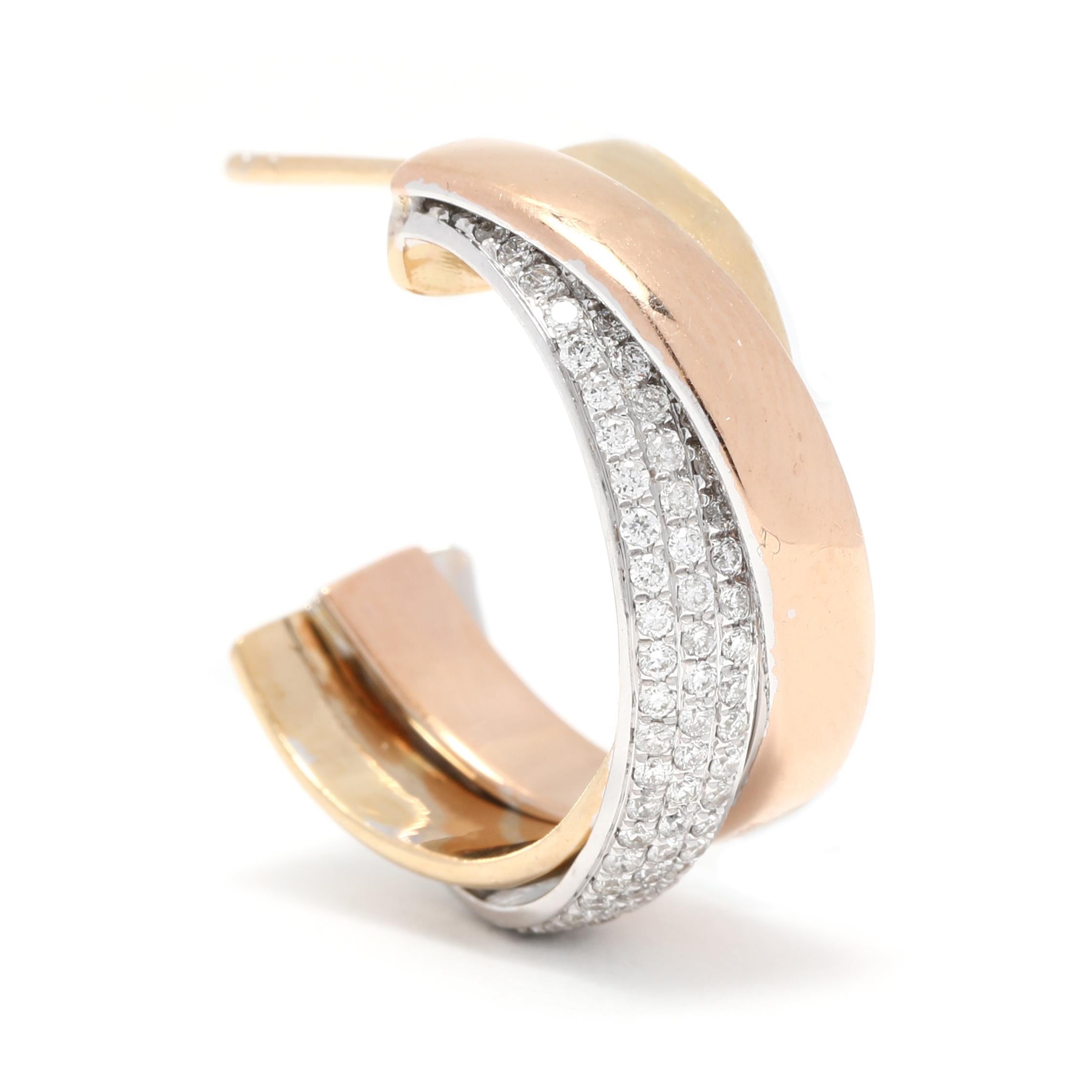 These gorgeous tri-color diamond hoop earrings are perfect for any special occasion. Crafted in 18K yellow, rose, and white gold, they feature a total of 1 carat of pavé diamonds in a unique crossover design. The length of the earrings is 7/8 inch