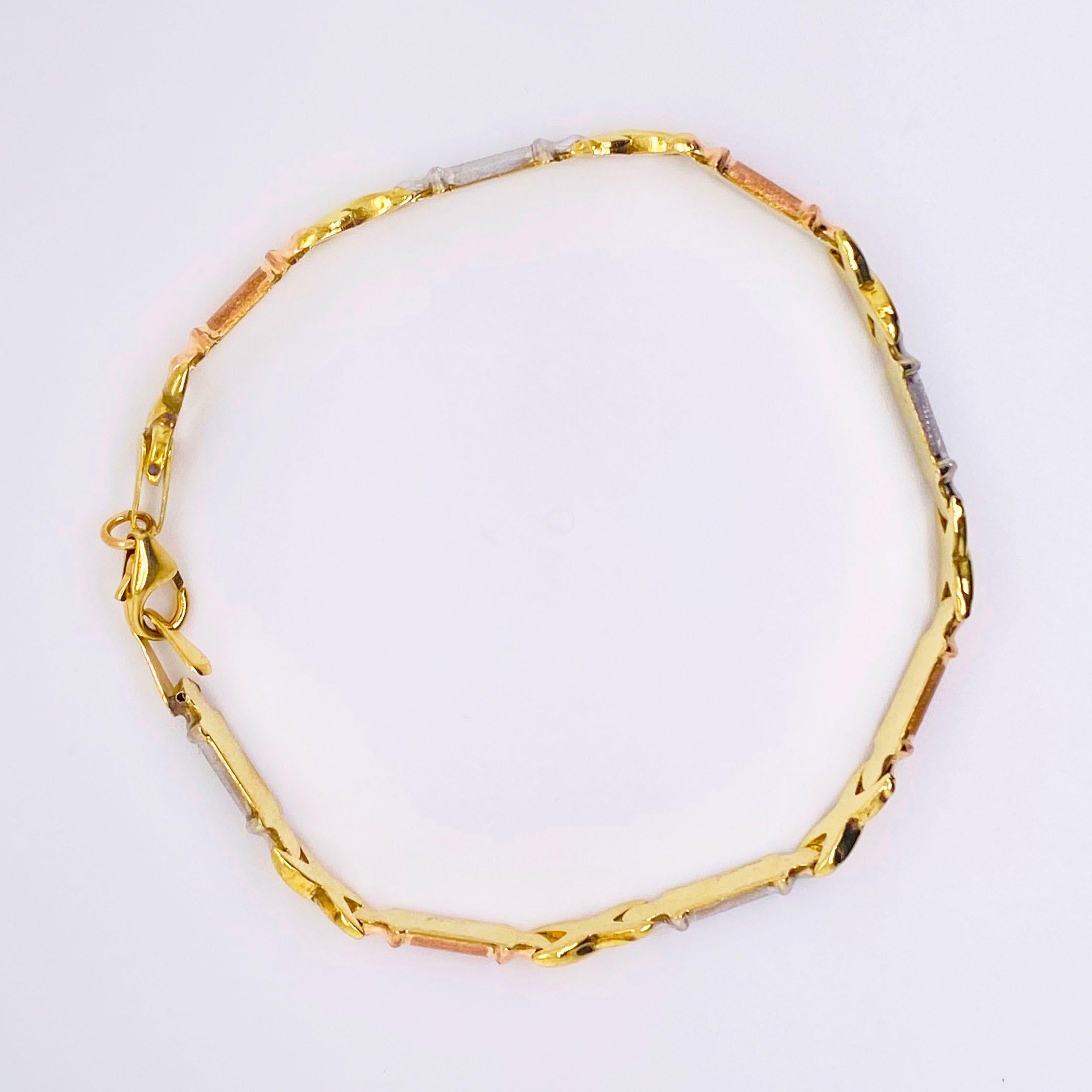 The gorgeous tri-colored gold bracelet is a handmade piece made with 10 karat gold. Each link is alternating in a unique pattern of white gold, yellow gold, rose gold, yellow gold, etc. The multi-colored gold allows this bracelet to go with every