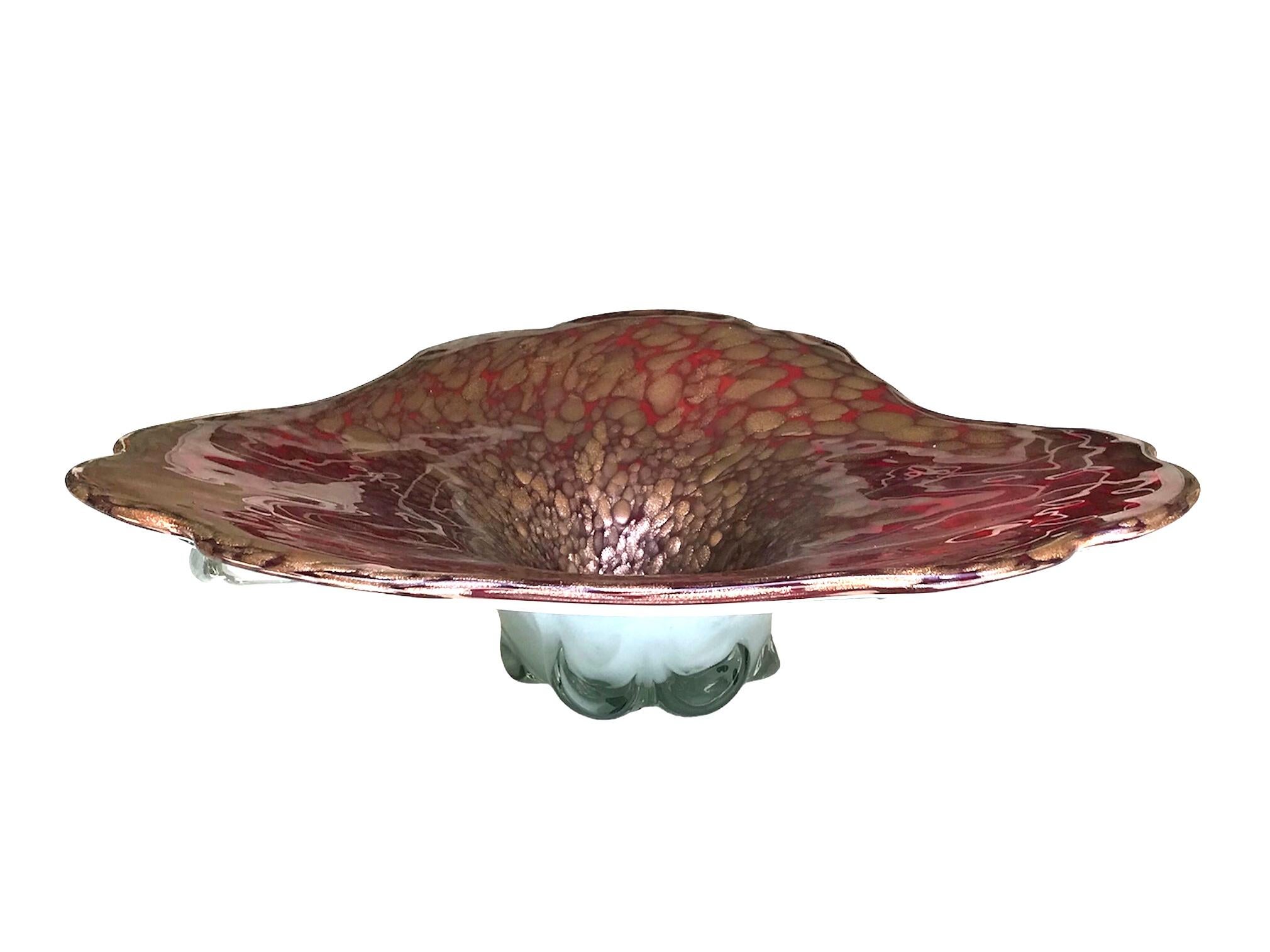 Unusual and large Tricorne shaped pulled cased glass bowl in blood red with gold-copper inclusions on a milky white back. Made in Murano by unknown maker in the 1960s. A midcentury beauty large enough to be used as a centerpiece for your dining