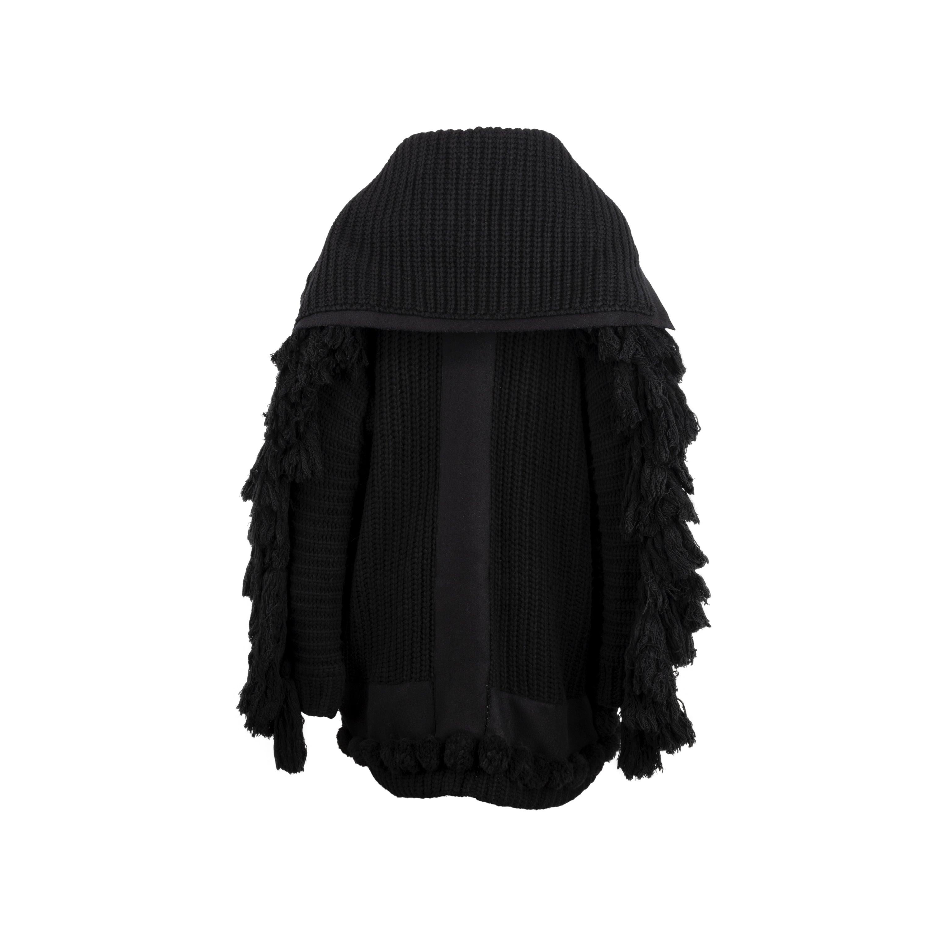 Diliborio black wool and cashmere coat. Oversized design with long sleeves, shawl collar, patch pockets and handmade maxi tassels. Total length:84; Measure sleeves:70; Bust:74; Material: 30% Wool, 15% cashmere, 25% polyamide
