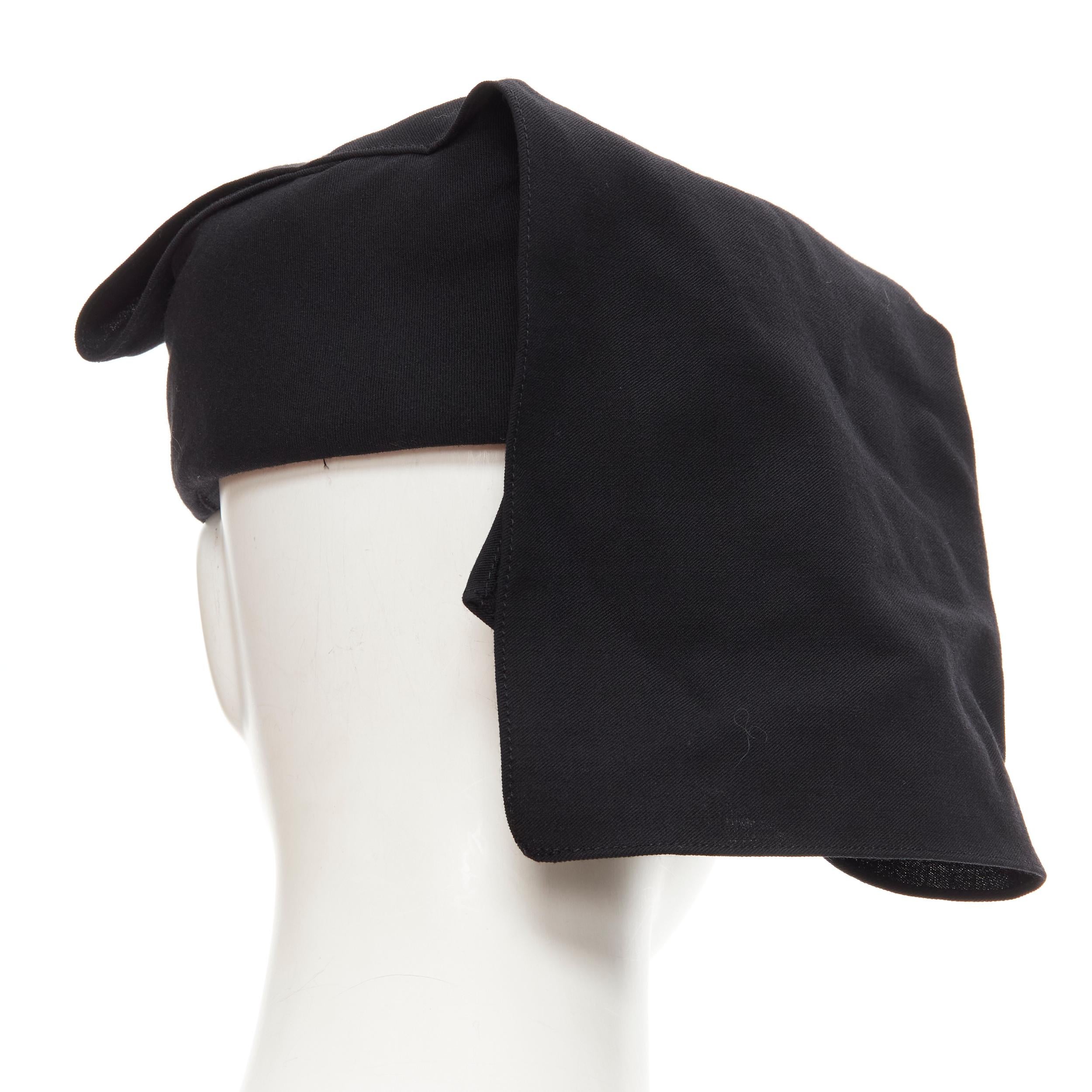 TRICOT COMME DES GARCONS Vintage black wool draped apostolnik raffia hat 
Reference: CRTI/A00658 
Brand: Comme Des Garcons 
Designer: Rei Kawakubo 
Collection: 2000's 
Material: Wool 
Color: Black 
Pattern: Solid 
Extra Detail: Raffia structured hat