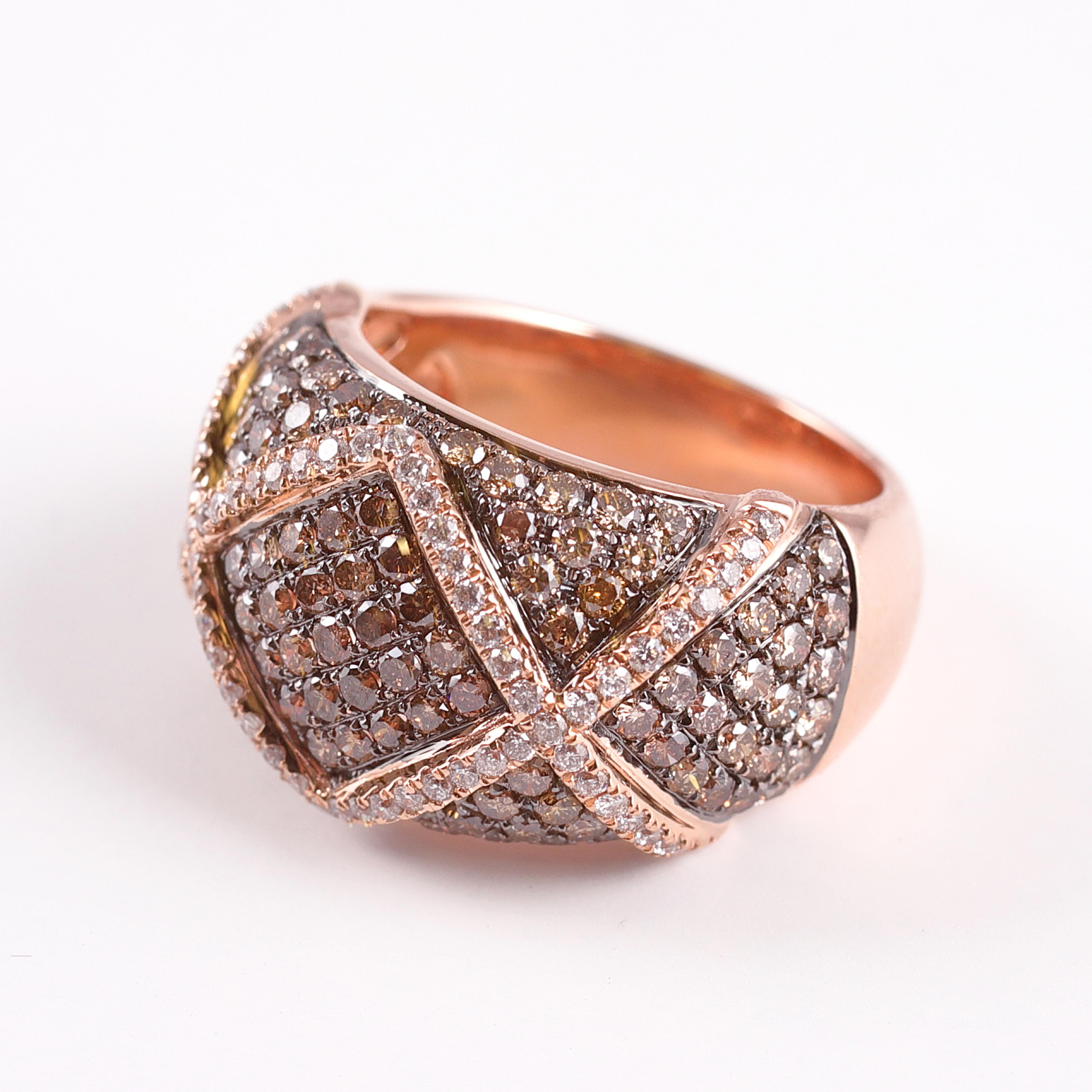 This 14 Karat Rose Gold ring boasts 1.80 carats of chocolate diamonds and 0.41 carats of white diamonds.  The white diamonds truly pop in the criss-cross setting by Adamor.  Size 7 1/4. 