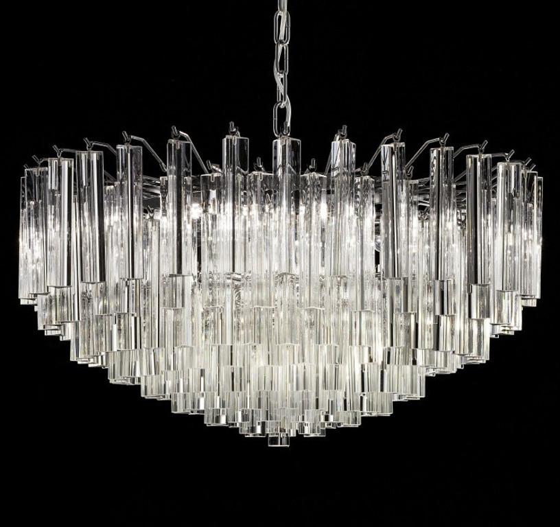 Italian chandelier with clear Murano glasses cut in Triedri technique mounted on chrome finish metal frame / Made in Italy
9 lights / E12 or E14 type / max 40W each
Diameter: 26.5 inches / Height: 13 inches plus chain and canopy
Order Reference #:
