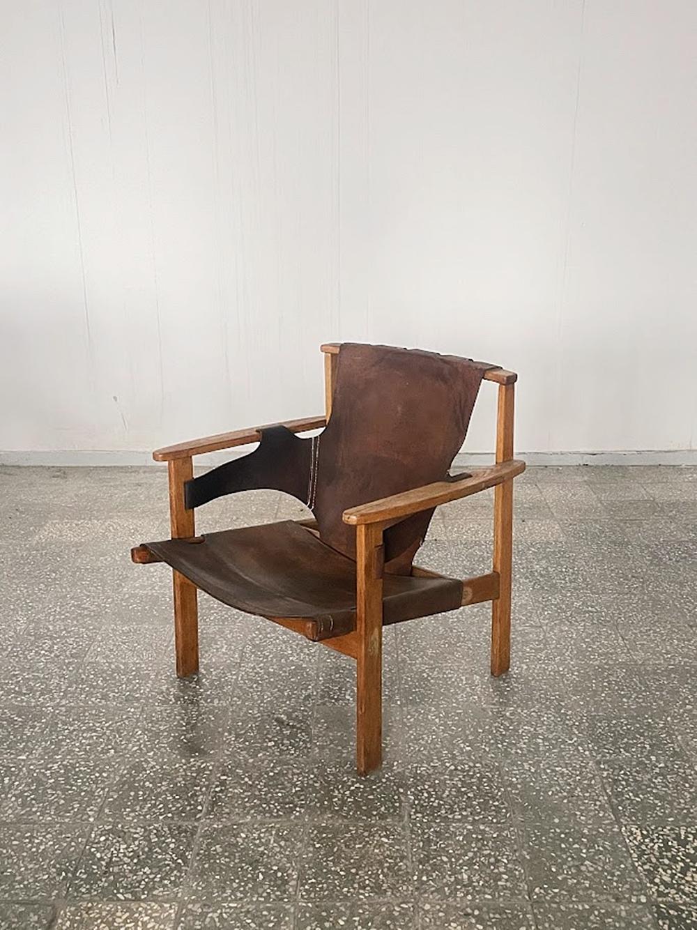 Introducing the Trienna Lounge Chair, a true masterpiece by Carl-Axel Acking, originally designed in 1957 and showcased at the Milan Triennial that same year as part of the Swedish design exhibit.

This iconic chair features a solid oak frame paired