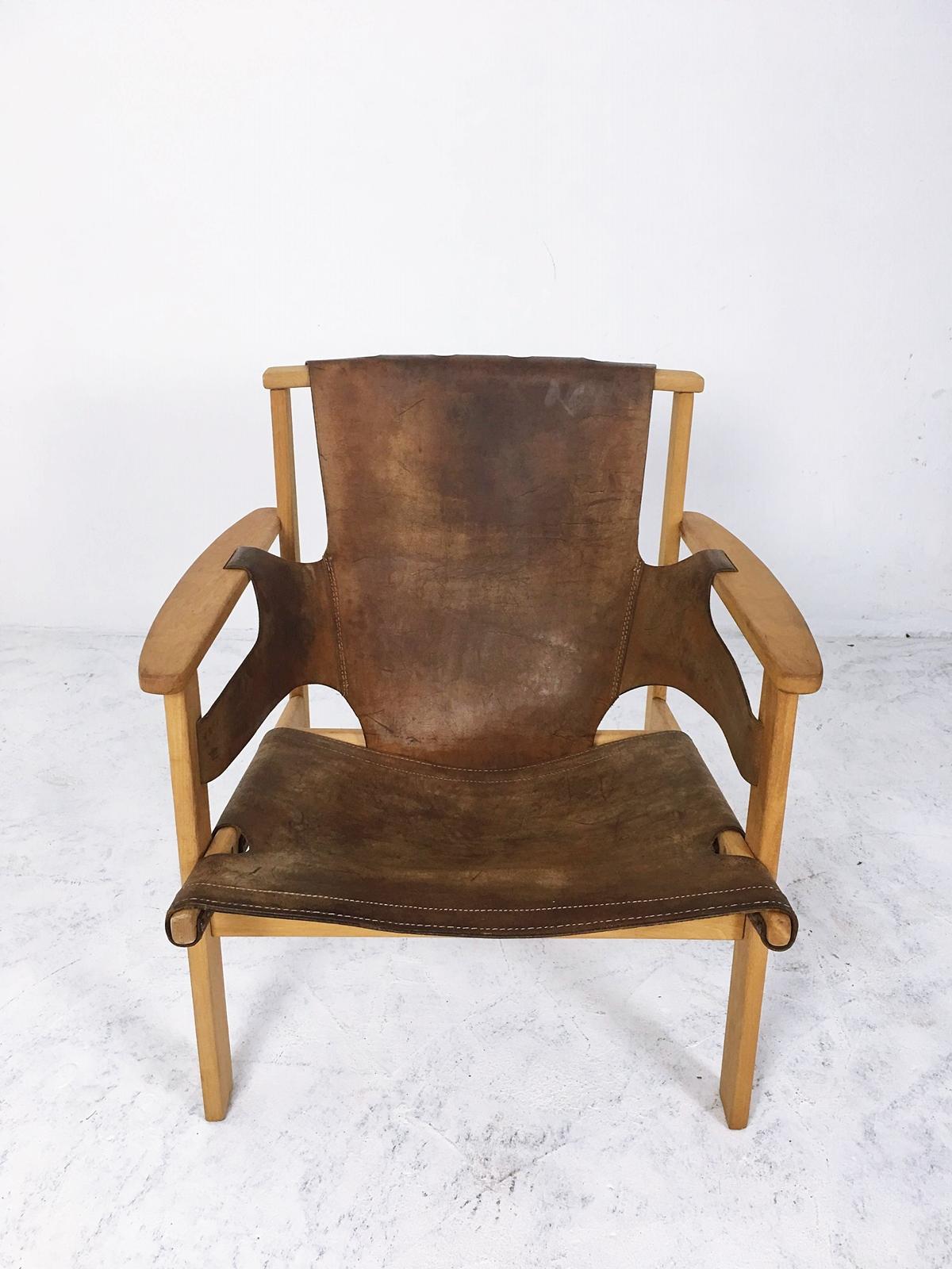 “Trienna” lounge chair by Carl-Axel Acking, made from oak and leather. This model was designed in 1957 and presented at the Milano Triennial that year, as part of the Swedish exhibit.
 Manufactured in Hungary 
Some Imperfections Minor losses.
