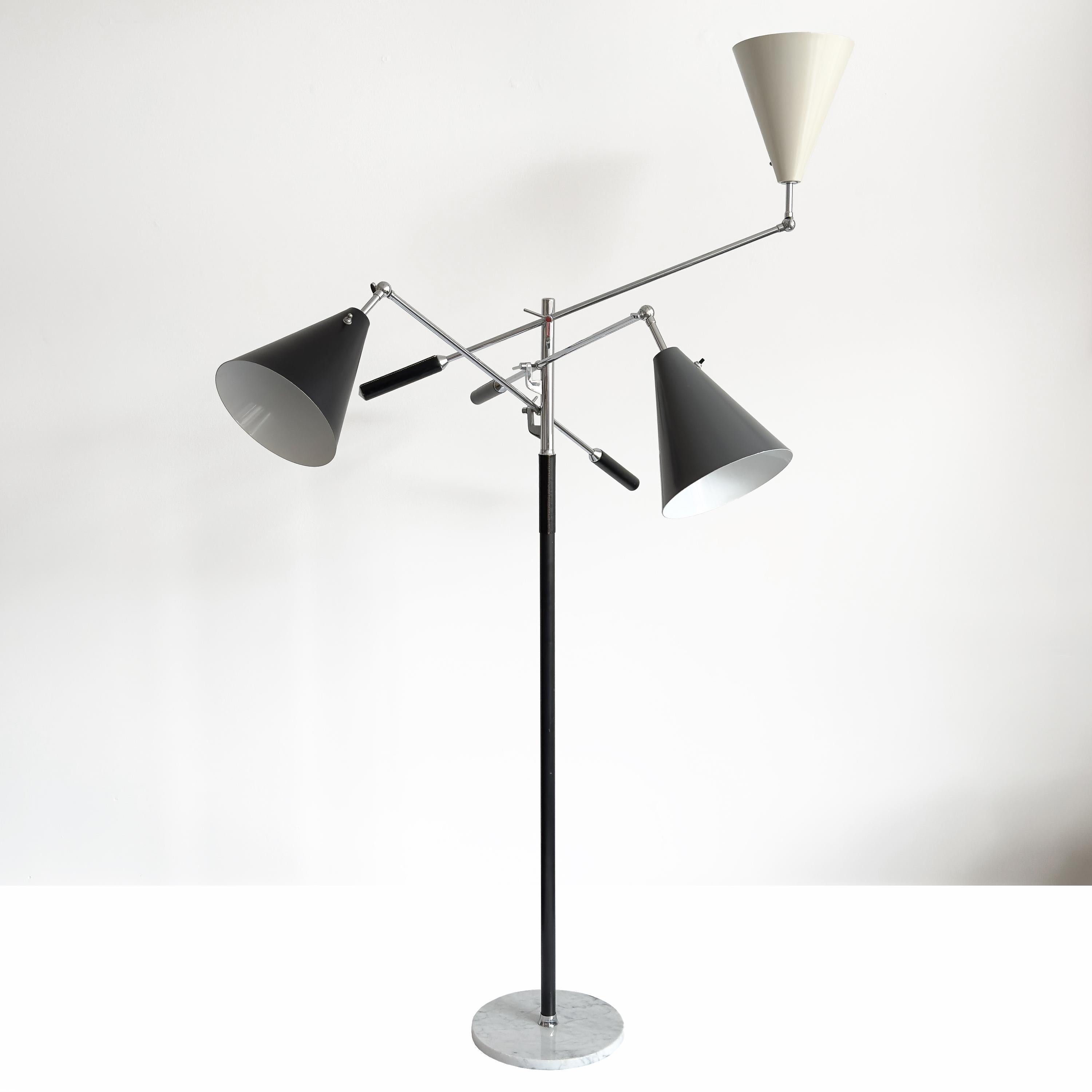 Illuminate your space with the iconic 1951 Triennale award-winning three-arm floor lamp by Angelo Lelii, a masterpiece of Italian design, this model was produced in Italy for export by Denis Casey for Casey Fantin, Florence, and imported to the USA