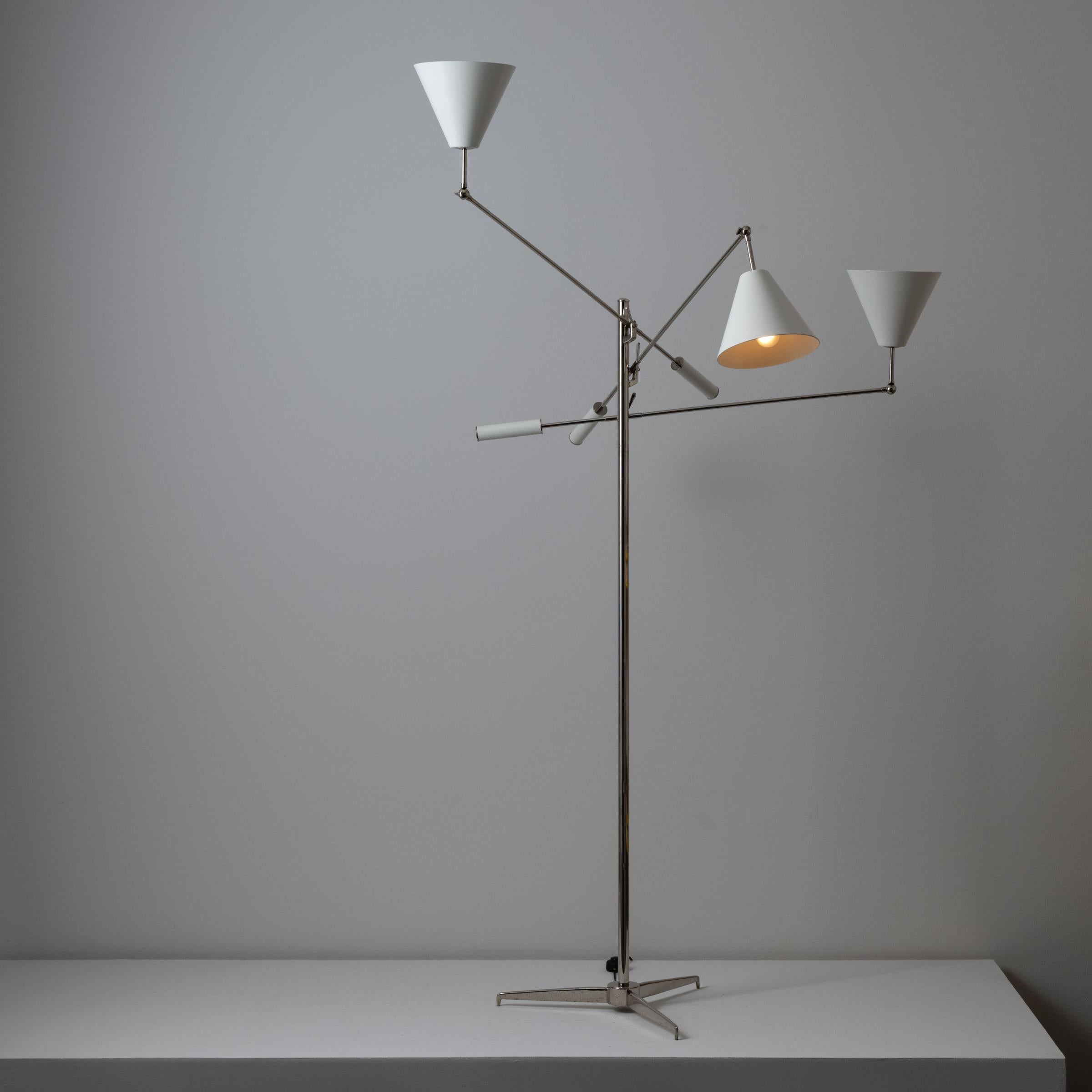 Triennale floor lamp by Angelo Lelli for Arredoluce. Designed and manufactured in Italy, circa 1950's. Chrome, enameled metal shades. Arms and shades adjust to various positions. Original cord with step switch. We recommend one E27 60w maximum bulb
