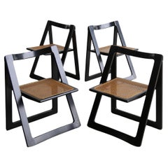 Juego de cuatro sillas plegables Trieste lacadas en negro, de Jacob & D'aniello para Bazz