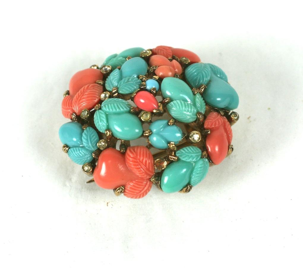 Trifari, Alfred Philippe round dome clip brooch of pink gold plated base metal, crystal rhinestones and faux coral, jade and turquoise fruit salad stones. This was produced as a pin with pastel coral fruit salads, signed KTF, before the change of