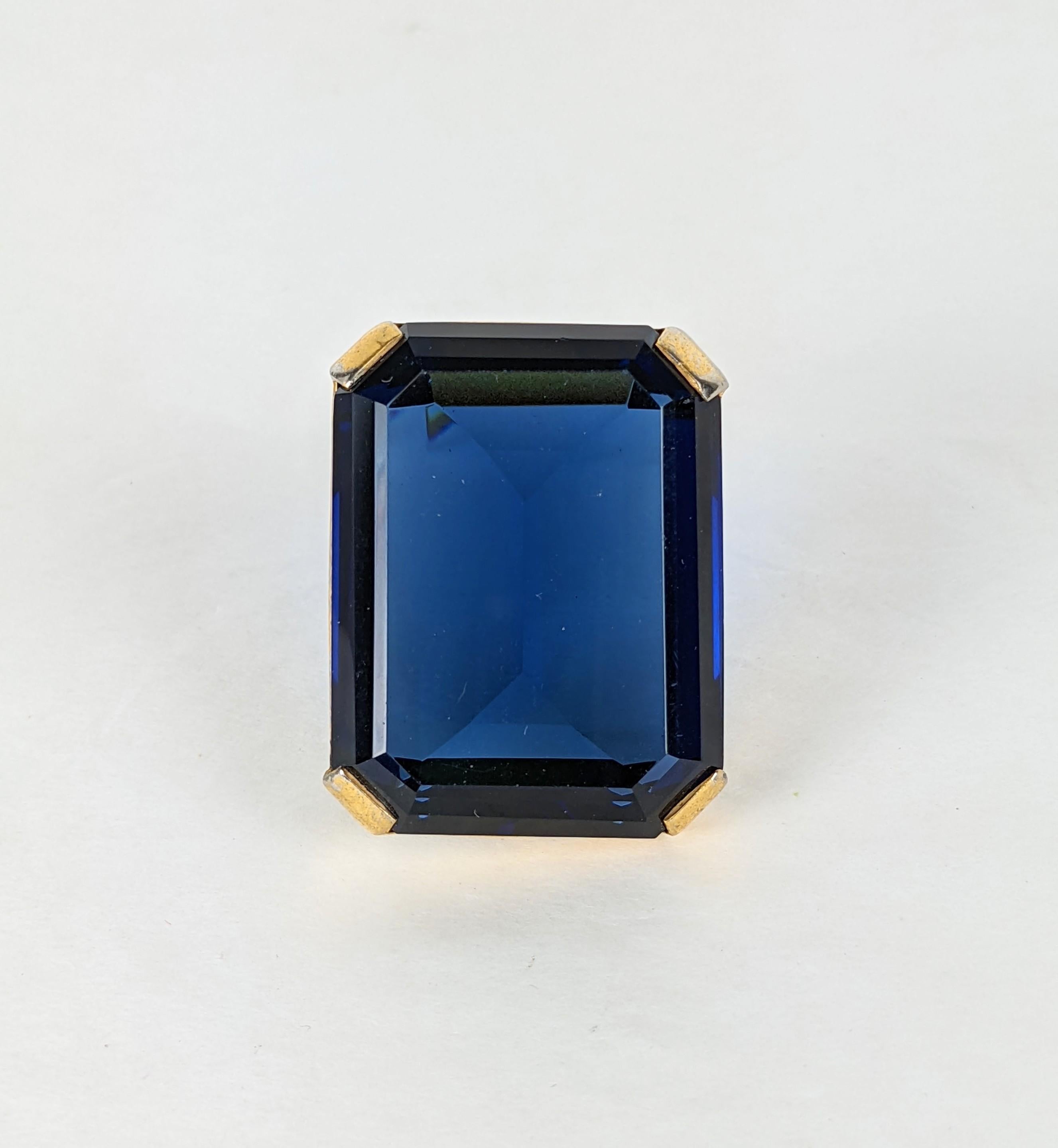 Trifari Alfred Phillipe Large Sapphire Clip from the 1930's Art Deco period. Gilt metal with large emerald cut sapphire paste, simple and elegant. 1.5