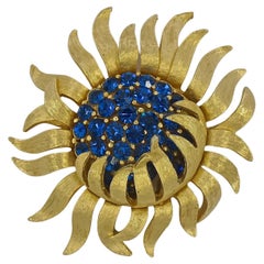 Trifari Articulated Textured Gold Plated and Blue Rhinestone Flower Brooch