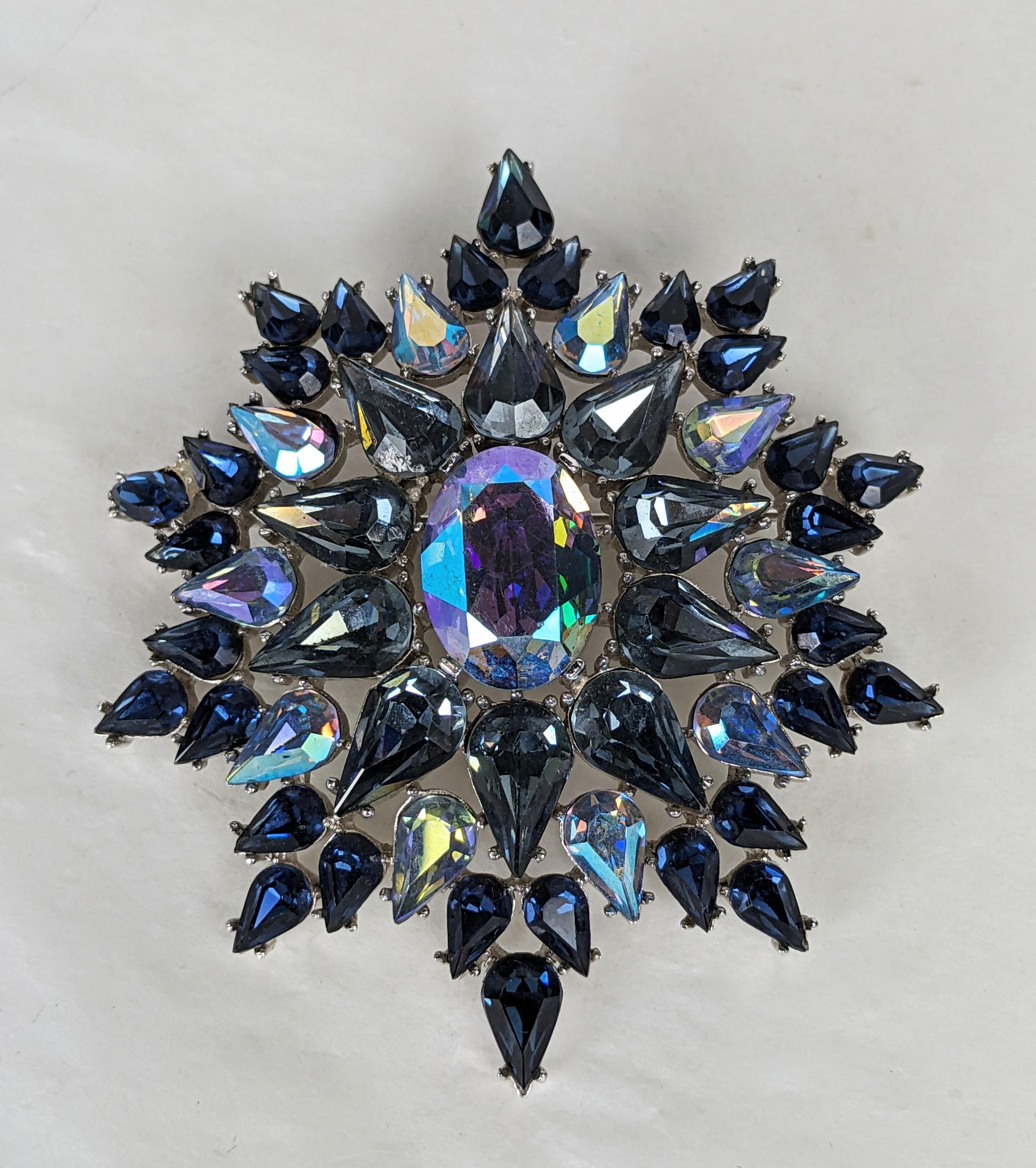 Striking Trifari Aurora and Sapphire Jeweled Crest from the 1960's. Fantastic design with a mixture of deep sapphire pastes and Aurora crystals. 1960's USA. 3