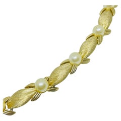 TRIFARI crown signed gold tone pearl designer bracelet