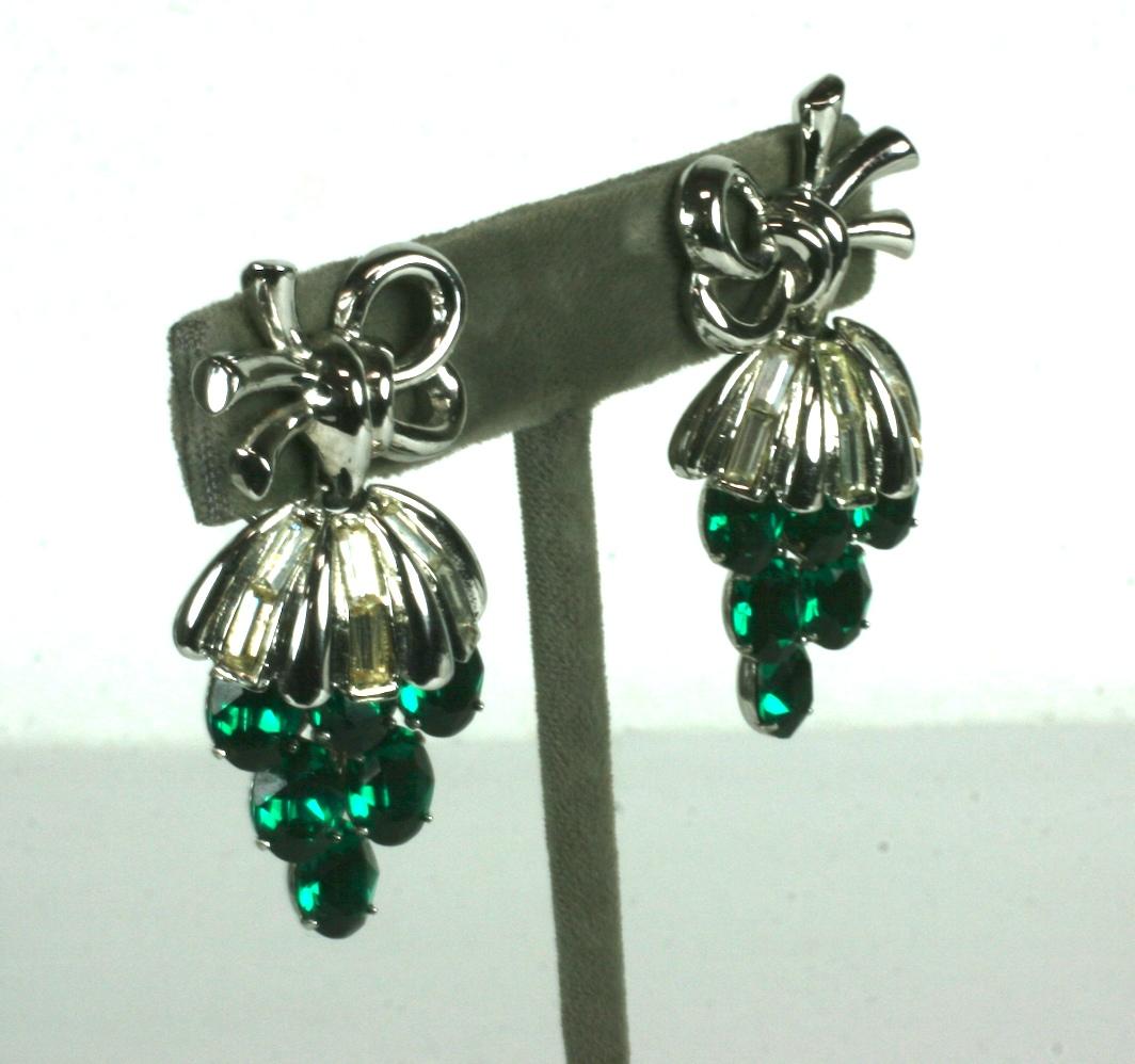 Charming Trifari Dangling Grape Tremblant Earrings with clip back fittings. Bow cap is decorated with crystal baguettes with a bunch of dangling faux emerald stones to represent grapes which shake as you move. 
1950's USA.     2